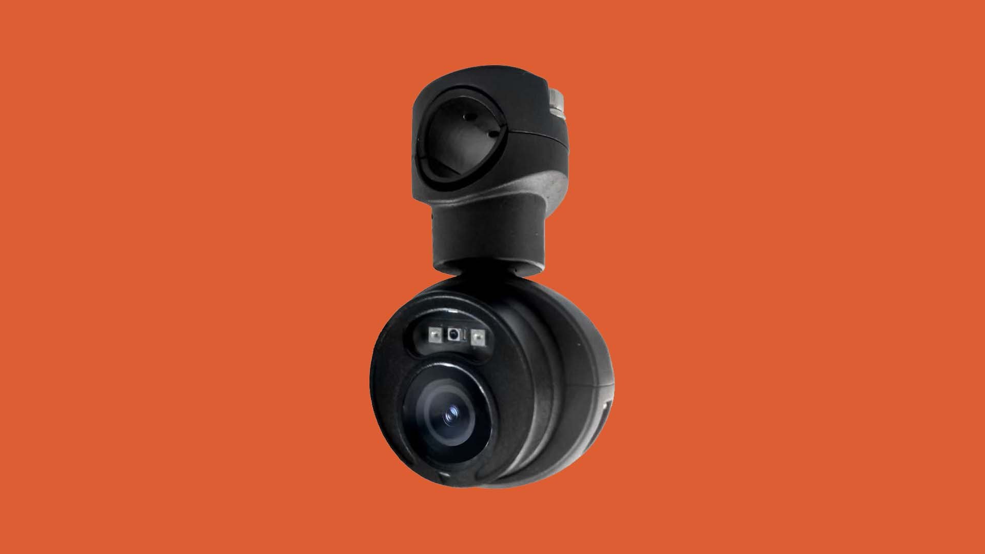 A compact black camera with a spherical lens and built-in sensors, set against an orange background.