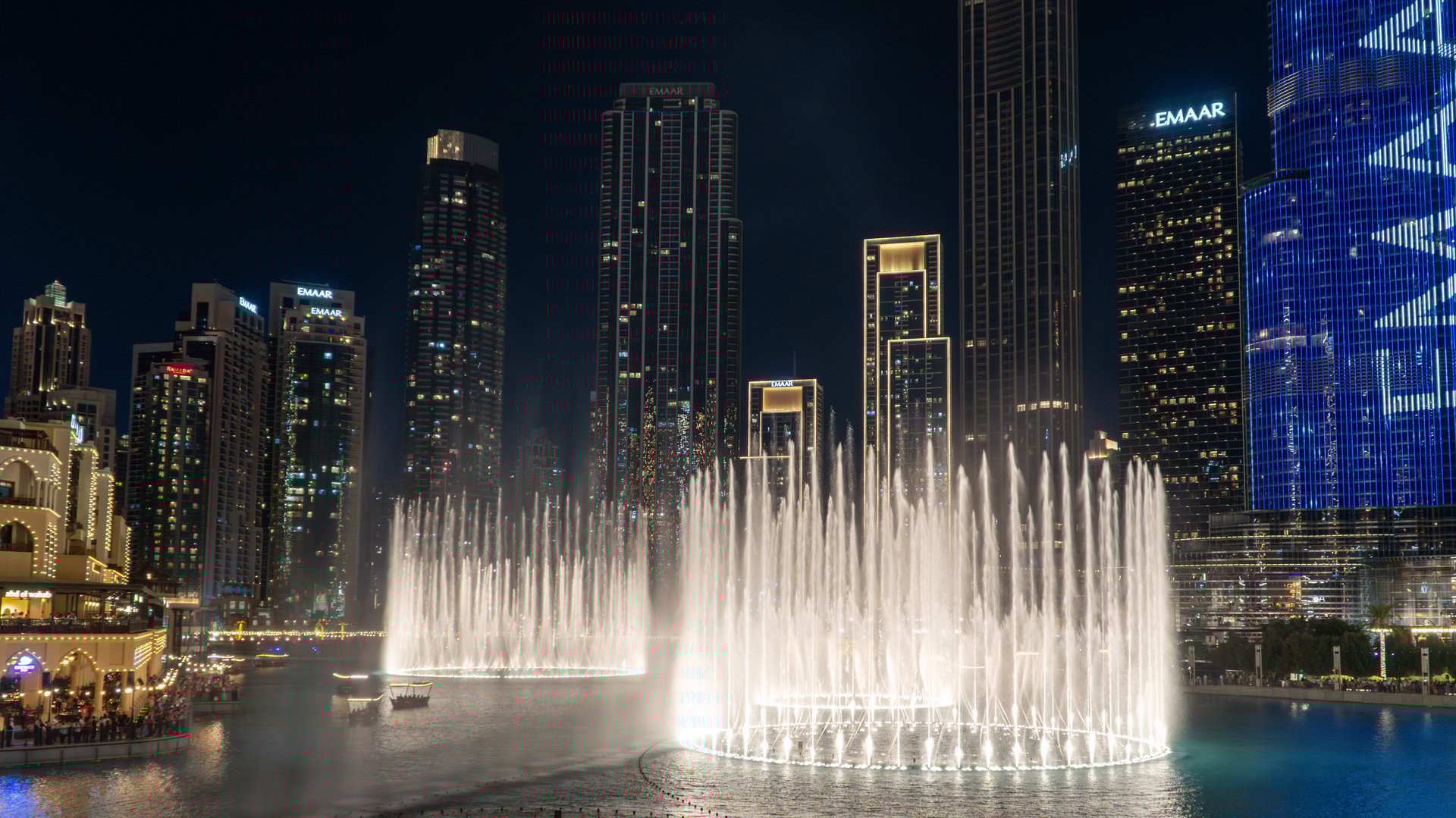 Dubai, UAE - 13 Nov 2024: Dubai Fountain, the world's largest choreographed fountain system, dazzles on Burj Khalifa Lake with synchronized lights, music, and water jets.