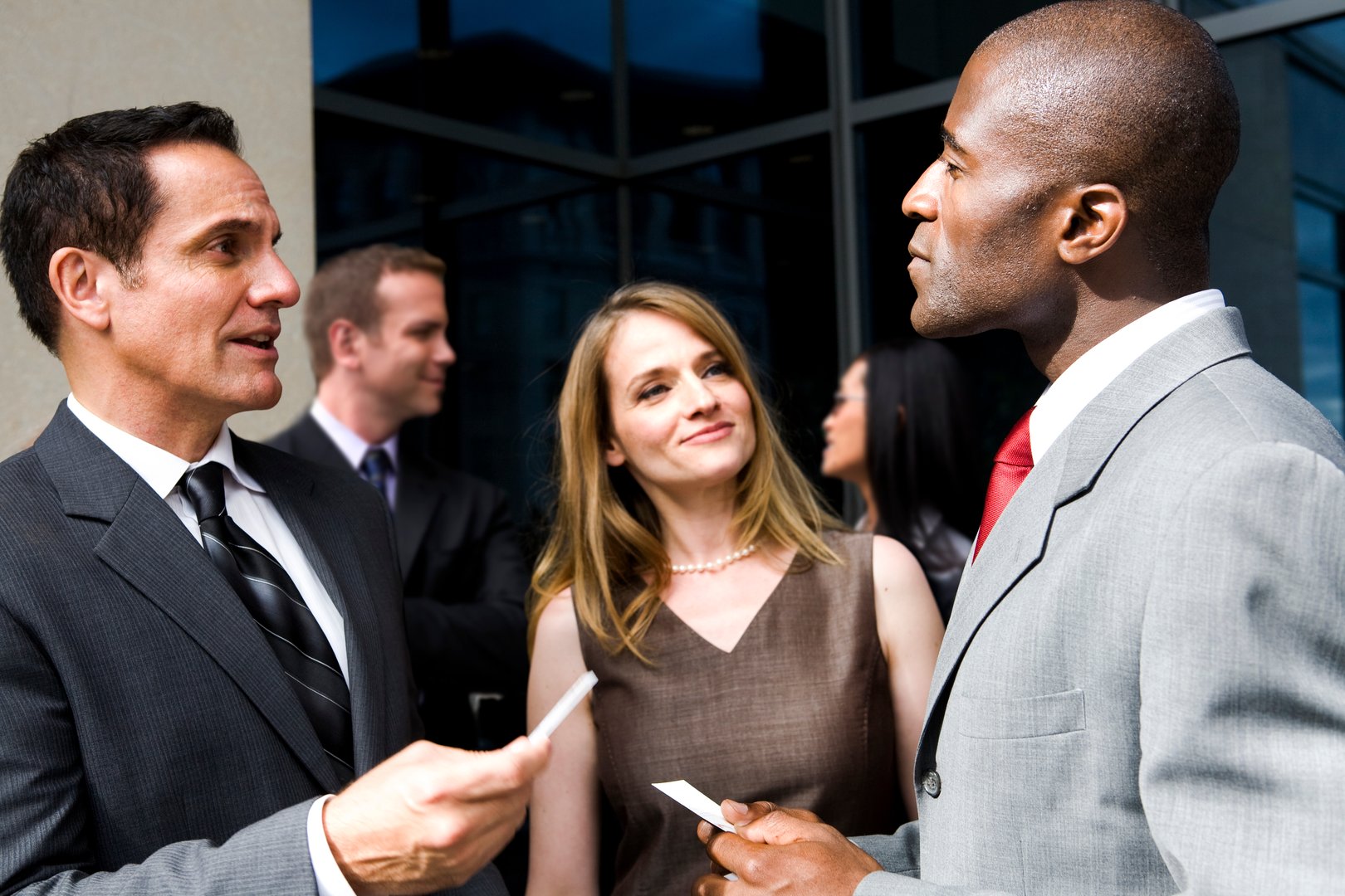 A group of diverse business people exchanging business cards