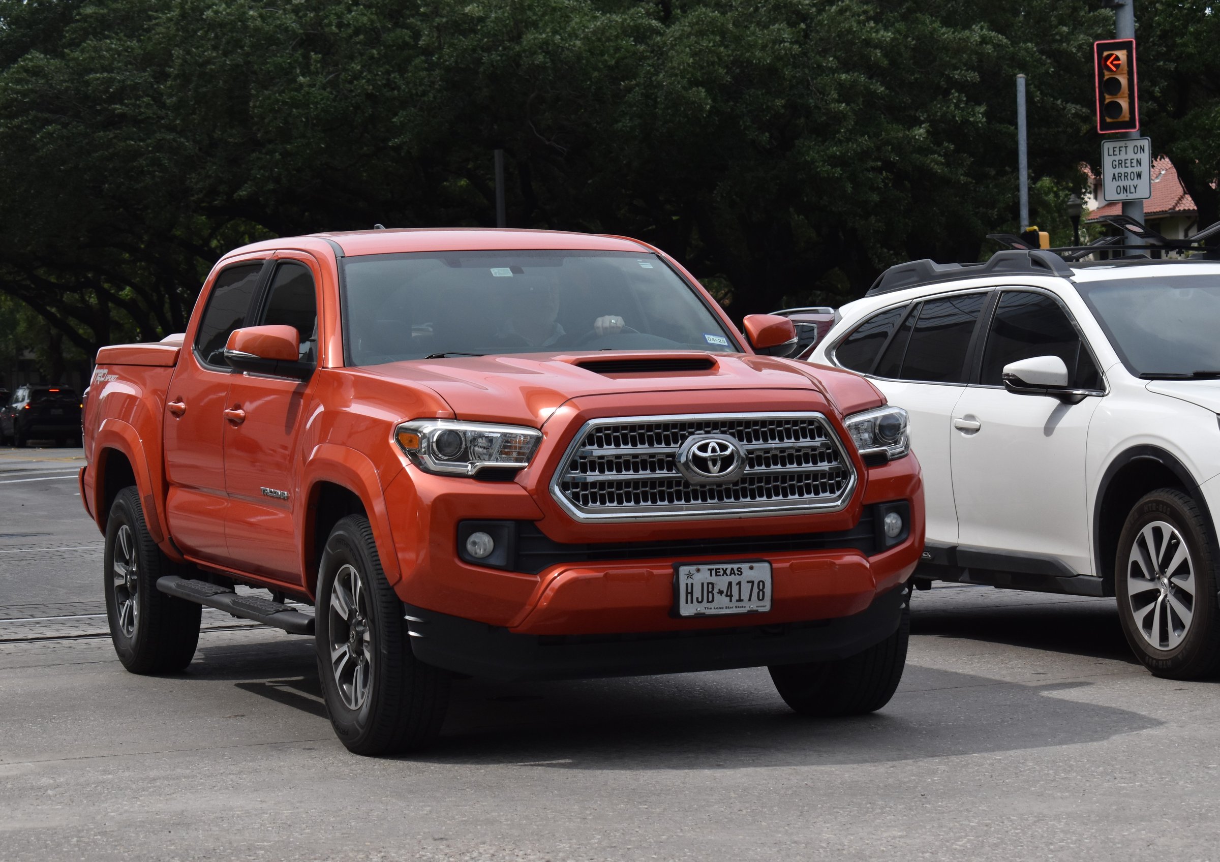 Red Toyota Tacoma with polished headlight lenses