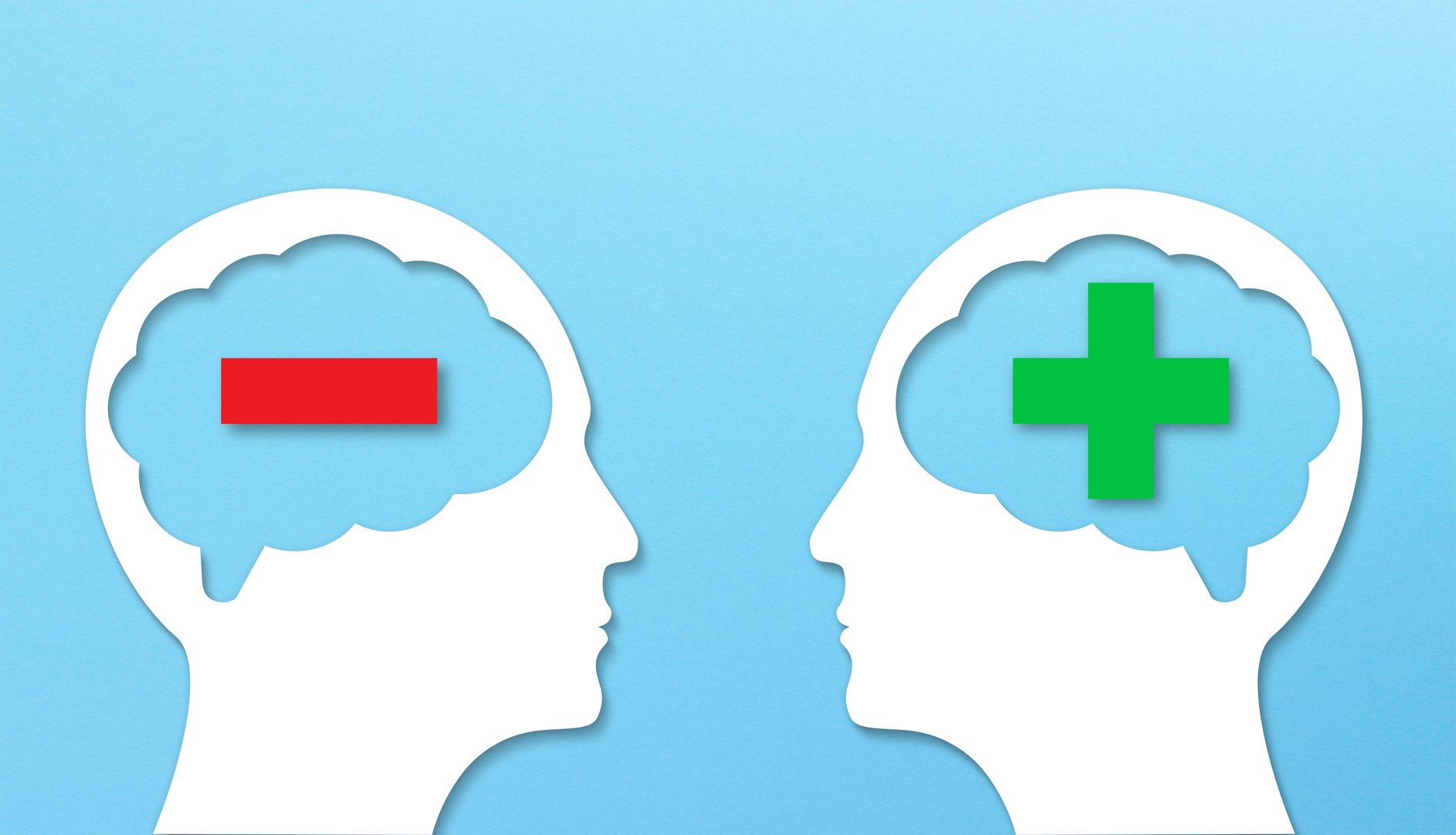 Positive and negative thinking, contrasts. Two heads silhouettes with plus and minus signs.