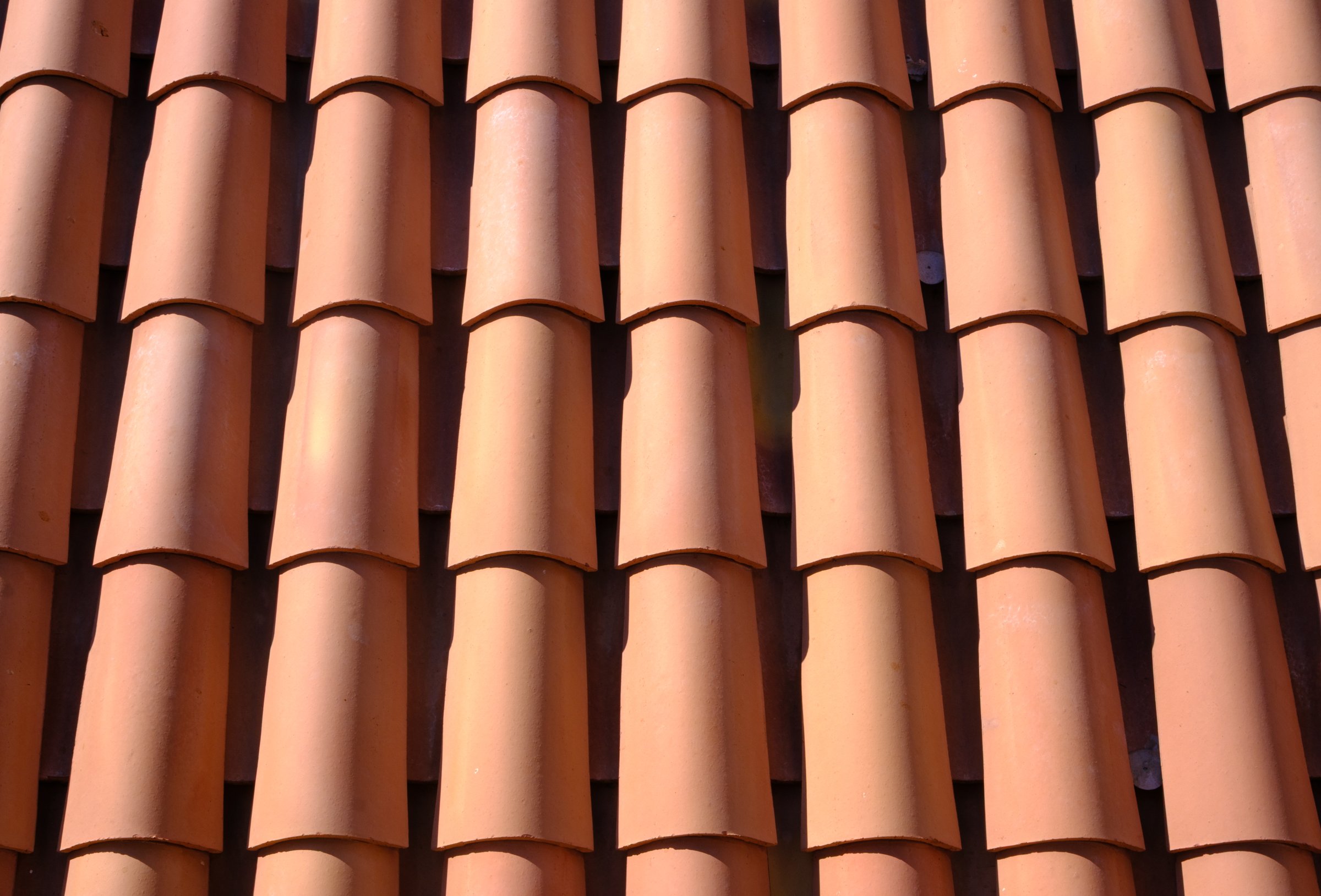 Background Texture Of Red Terracotta Clay Roof Tiles In A Mediterranean Country