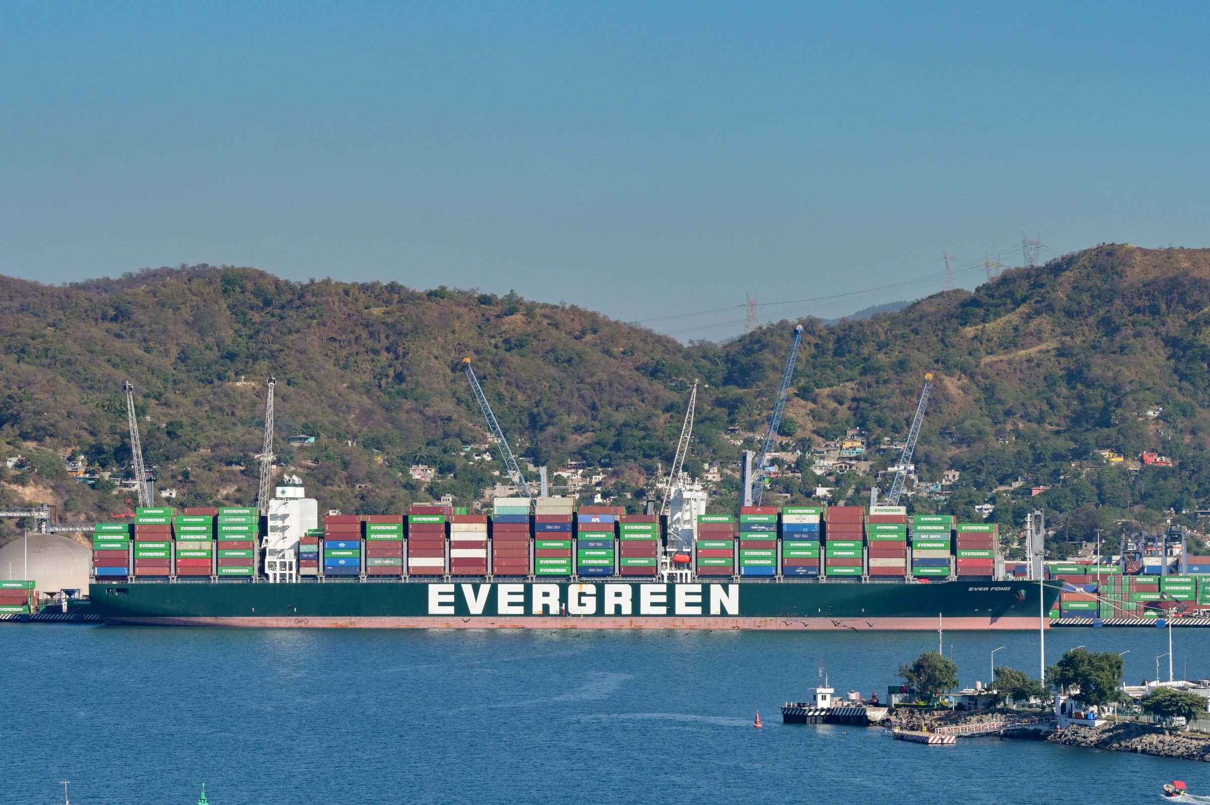 Manzanillo, Colima, Mexico - 16 January 2024: Large contaner ship operated by the Evergreen group docked in the port of Manzanillo