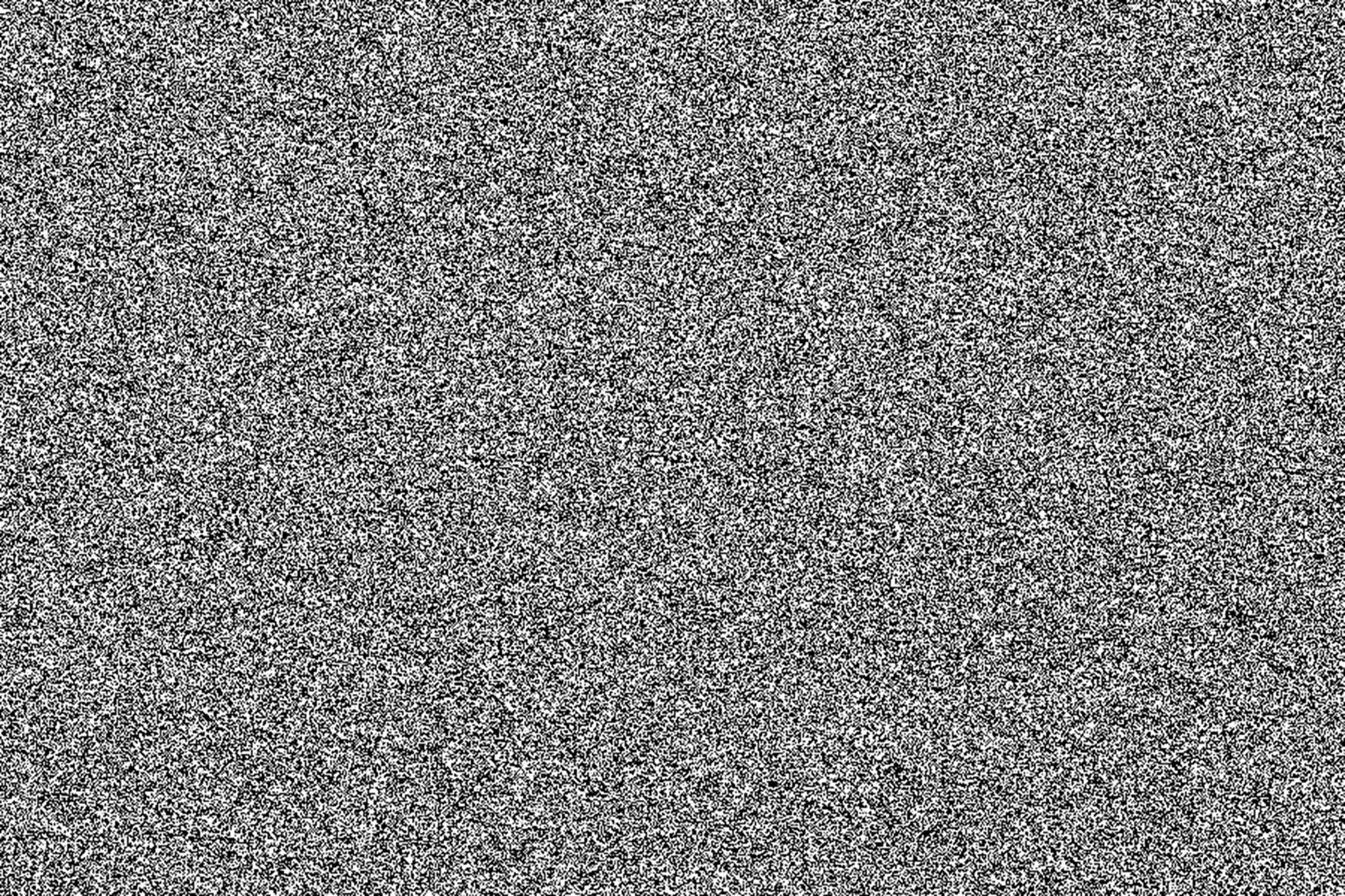 Black white noise dot grain background. Illustration dotwork pattern. Densely dotted halftone texture. Black stipple sand grain effect.