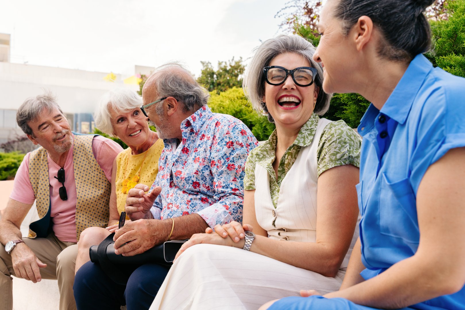 Group of senior friends meeting outdoors in the city and having fun - Cheerful old people bonding together, concepts about elderly, quality of life and aging lifestyle