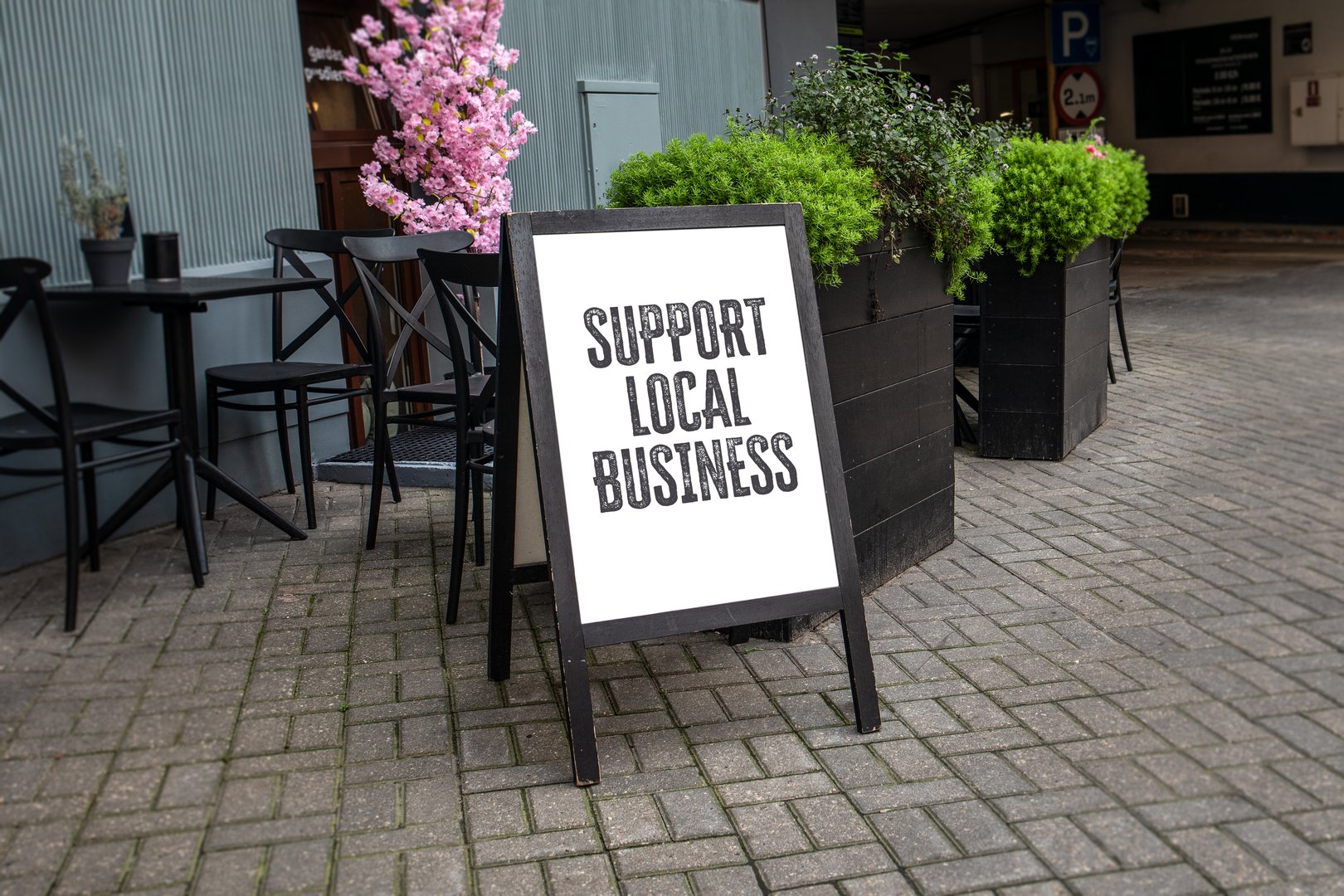 Support Local Business. Advertising banner on the street.