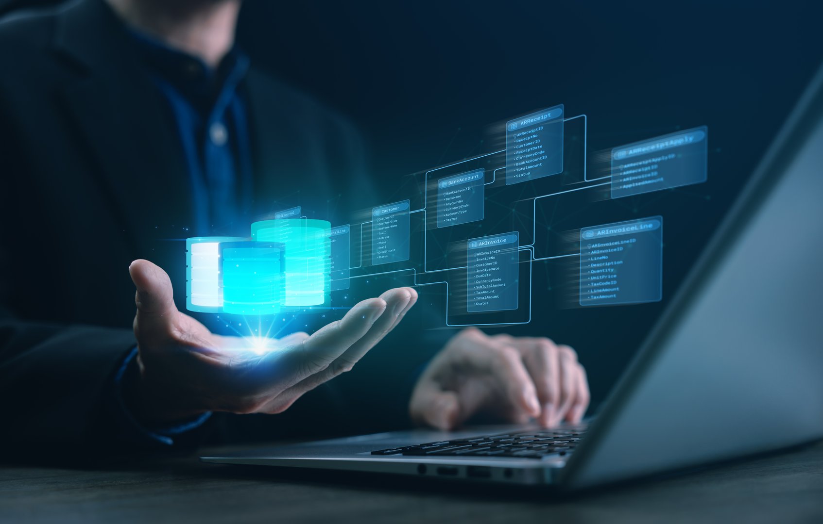 A developer holding a glowing hologram of an SQL database schema with relational tables and links, illustrating data modeling, system architecture, and modern database management for IT solutions.