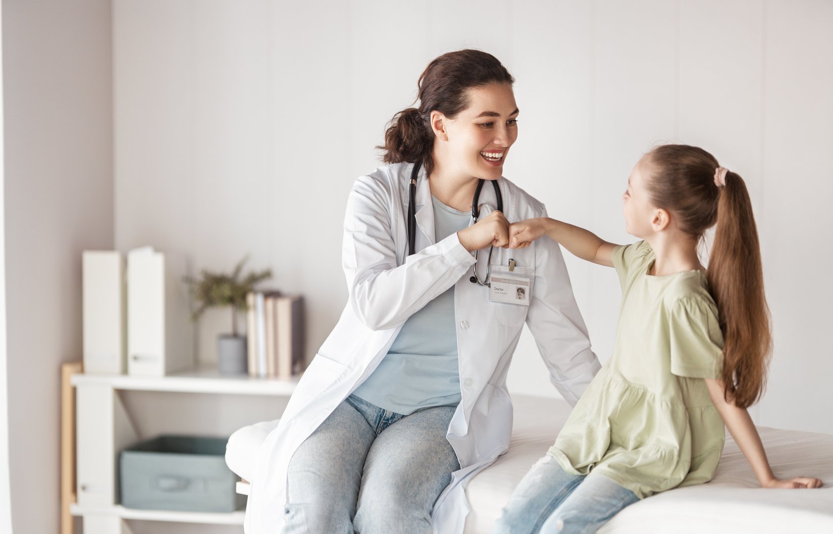 Girl patient listening to a doctor in medical office.