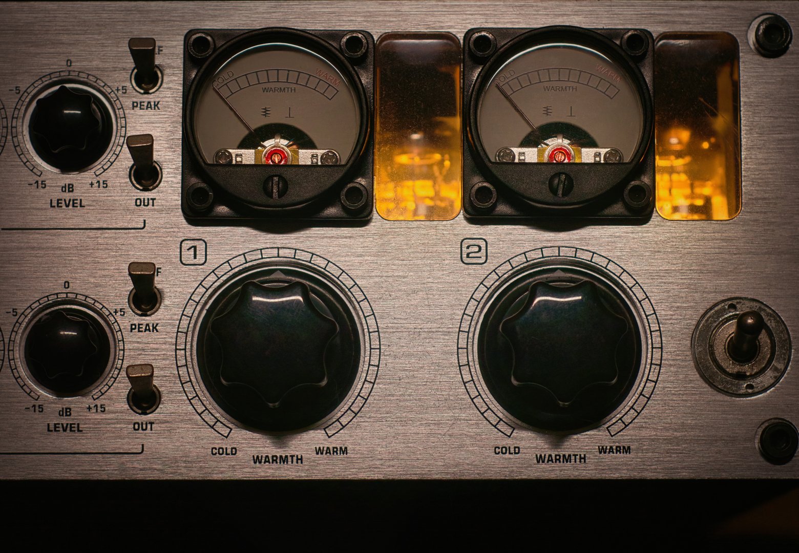 Professional audio preamp with illuminated vacuum tubes, knobs, and faders, ideal for sound engineering and music production