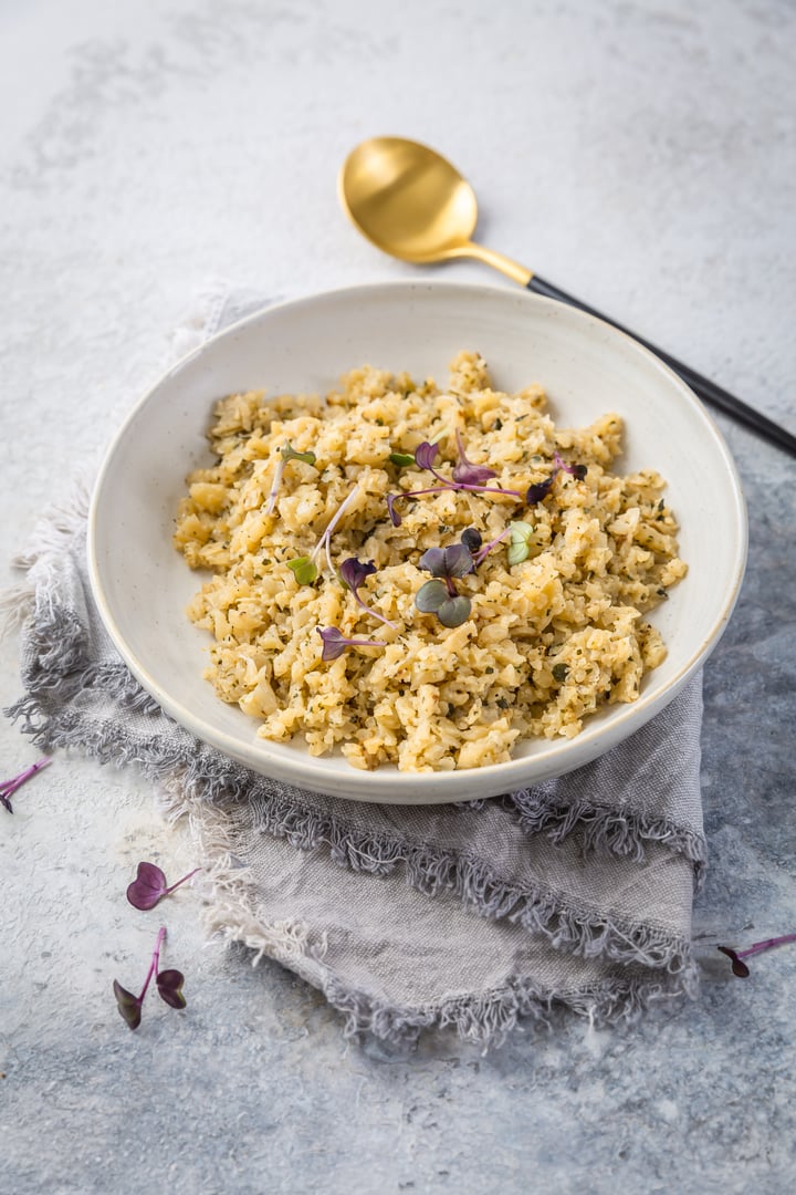 Roasted organic cauliflower rice with herbs - paleo and ketogenic diet concept