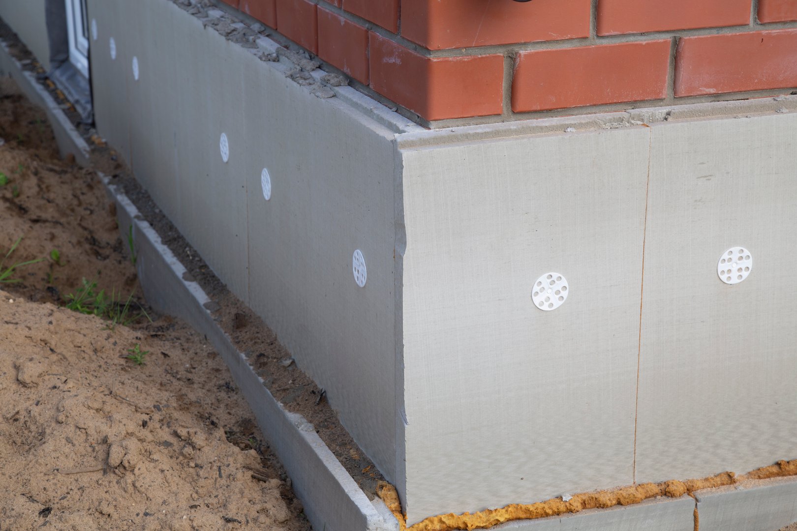 House insulation. Rigid insulation installed in the lower part of the house.