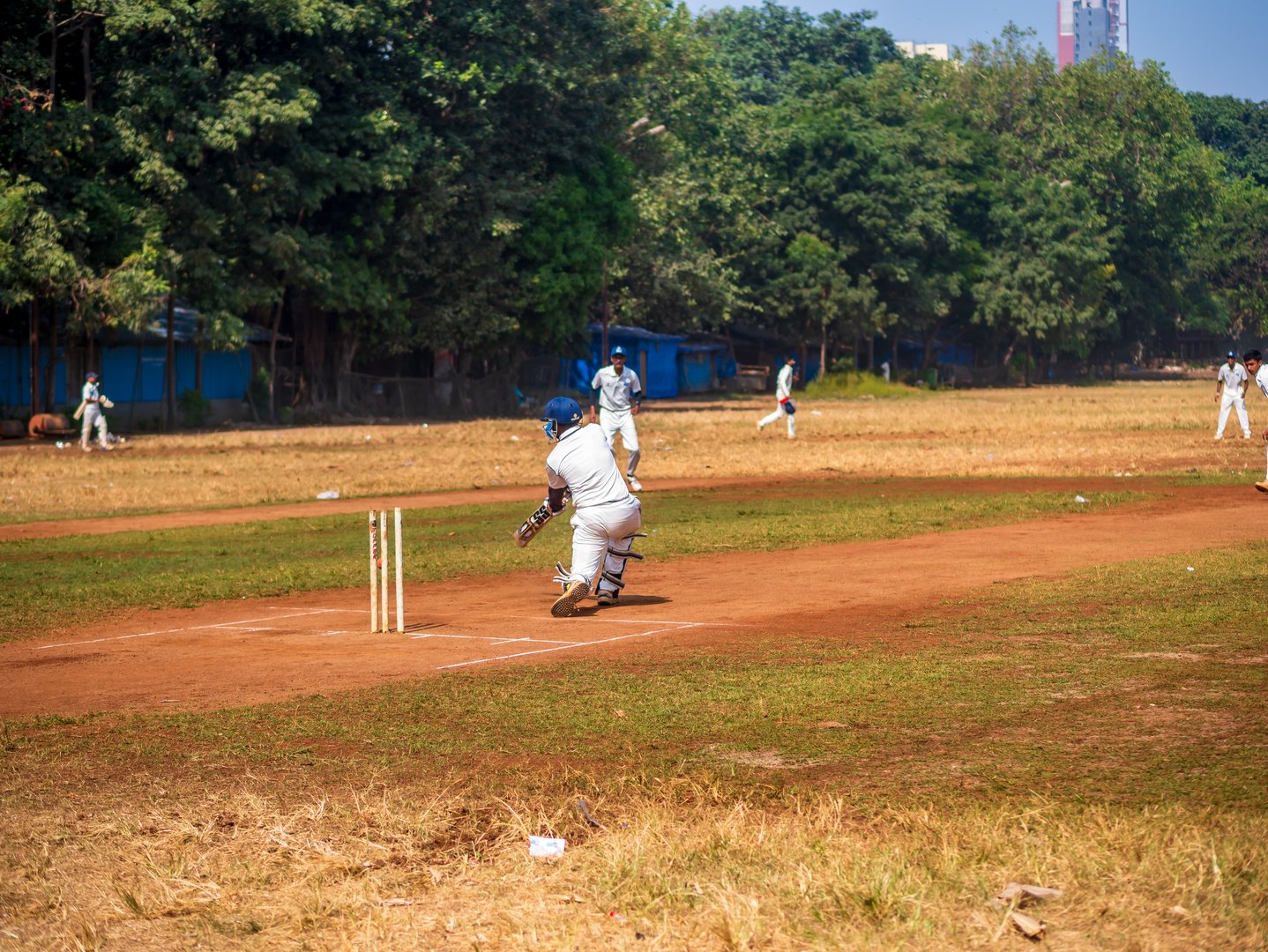 Mumbai, India - December 18, 2019: Indias most famous sport Cricket practiced by kids at local Mumbai ground