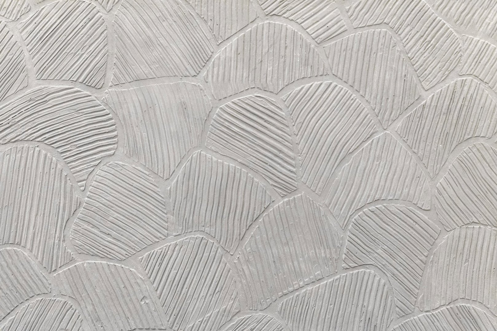 Textured plaster surface with geometric relief pattern