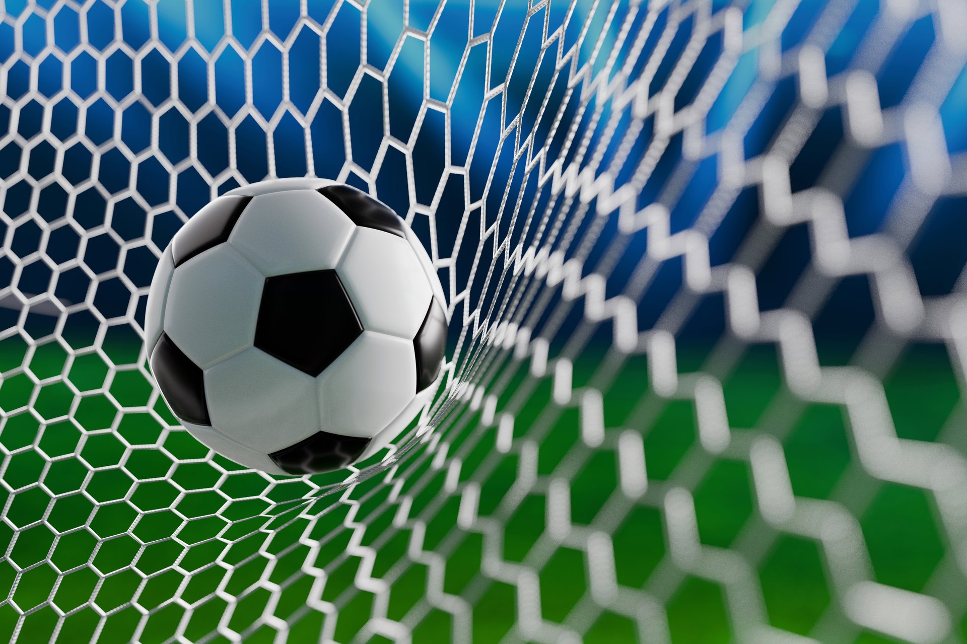 Close-up of a soccer ball in the goal net under stadium lights, representing scoring, success, and the thrill of a football game. Soccer ball in the goal, goal scored. Football