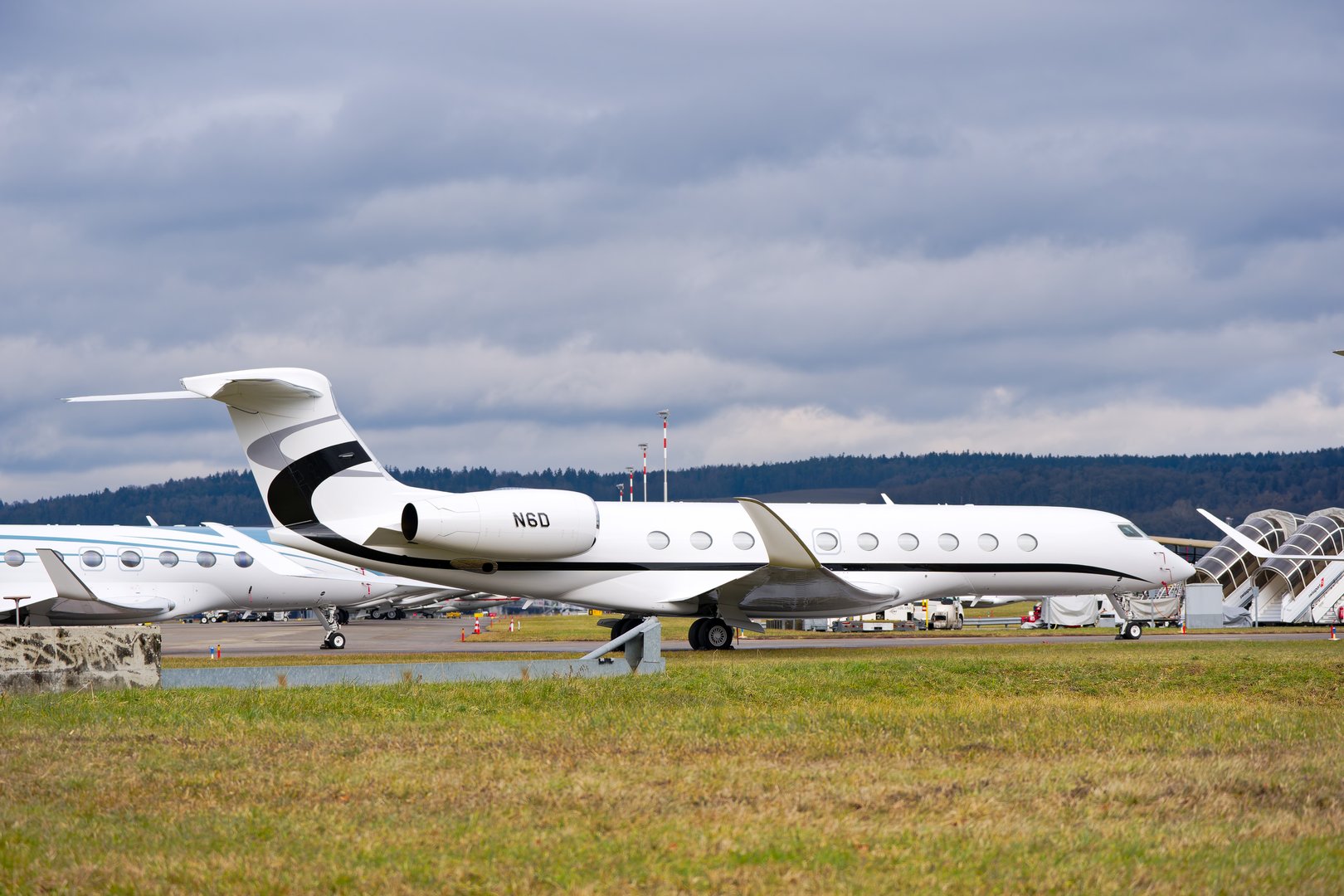 Parked private jet at Swiss Airport Zürich Kloten on a winter day. Photo taken January 23rd, 2025, Zurich Kloten, Switzerland.