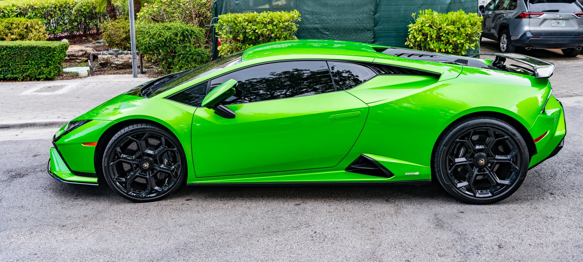 Miami Beach, Florida USA - June 9, 2024: 2023 Lamborghini Huracan Tecnica green at miami beach. Lamborghini is a luxury italian car maker