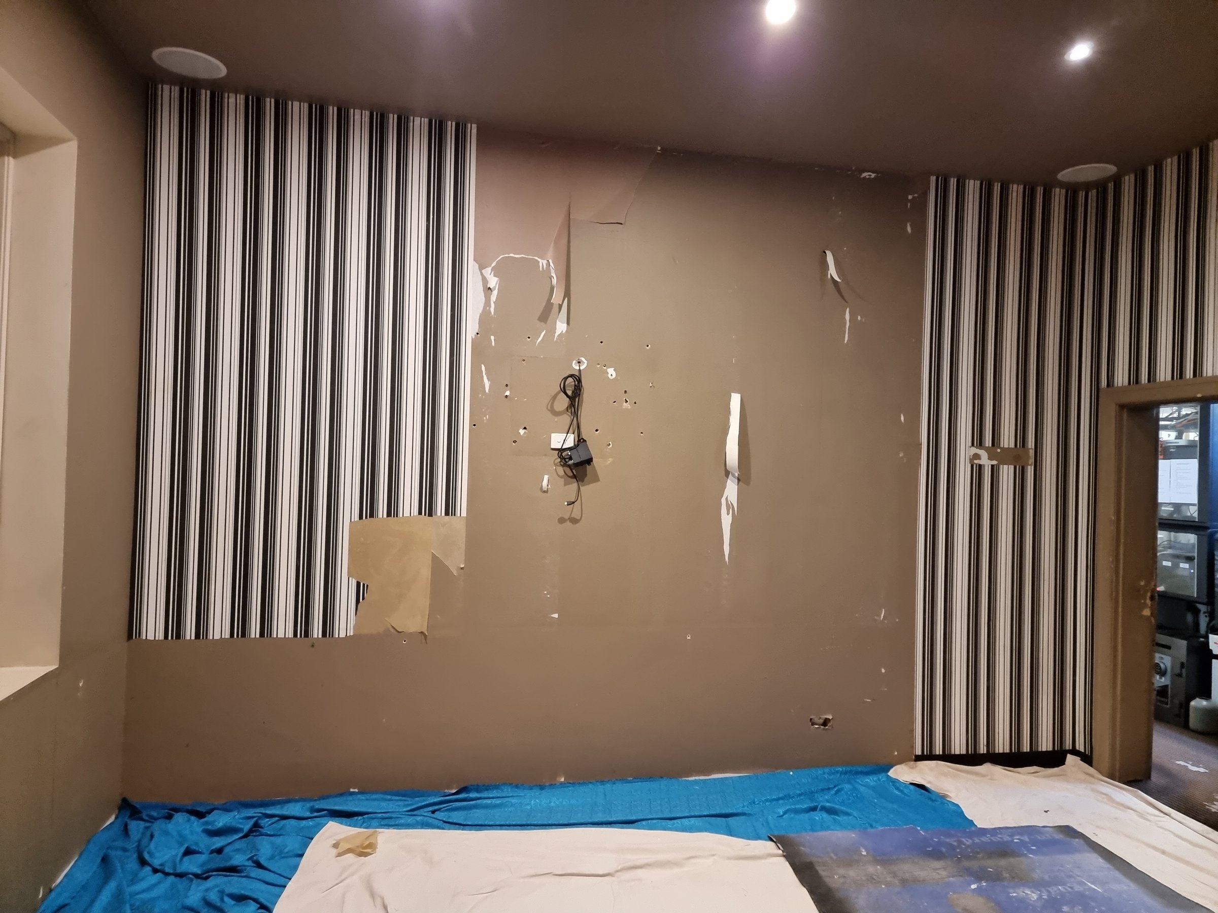 Professional wallpaper removal service in progress