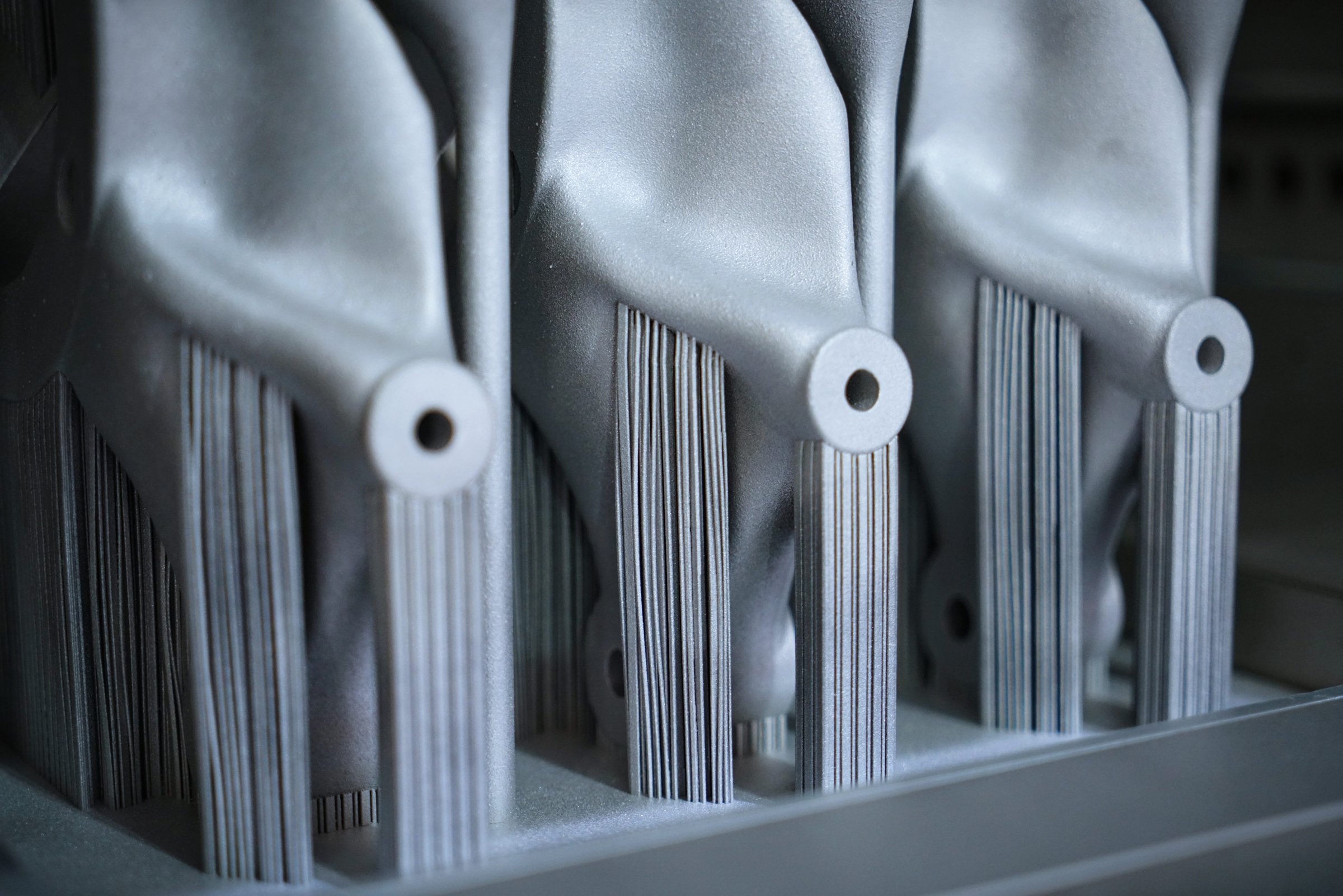 Object printed on metal 3d printer. A model created in a laser sintering machine close-up. Concept of 4.0 industrial revolution. Progressive modern additive technology.