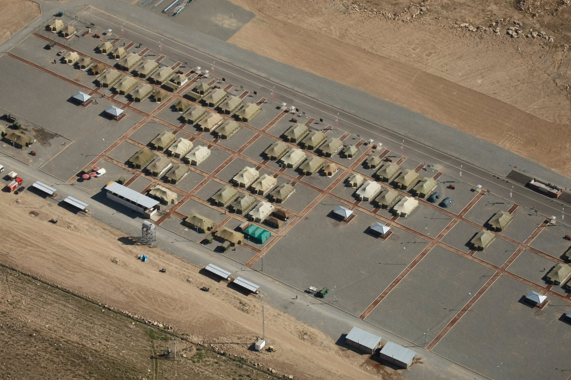 Military base in rocky mountains aerial view