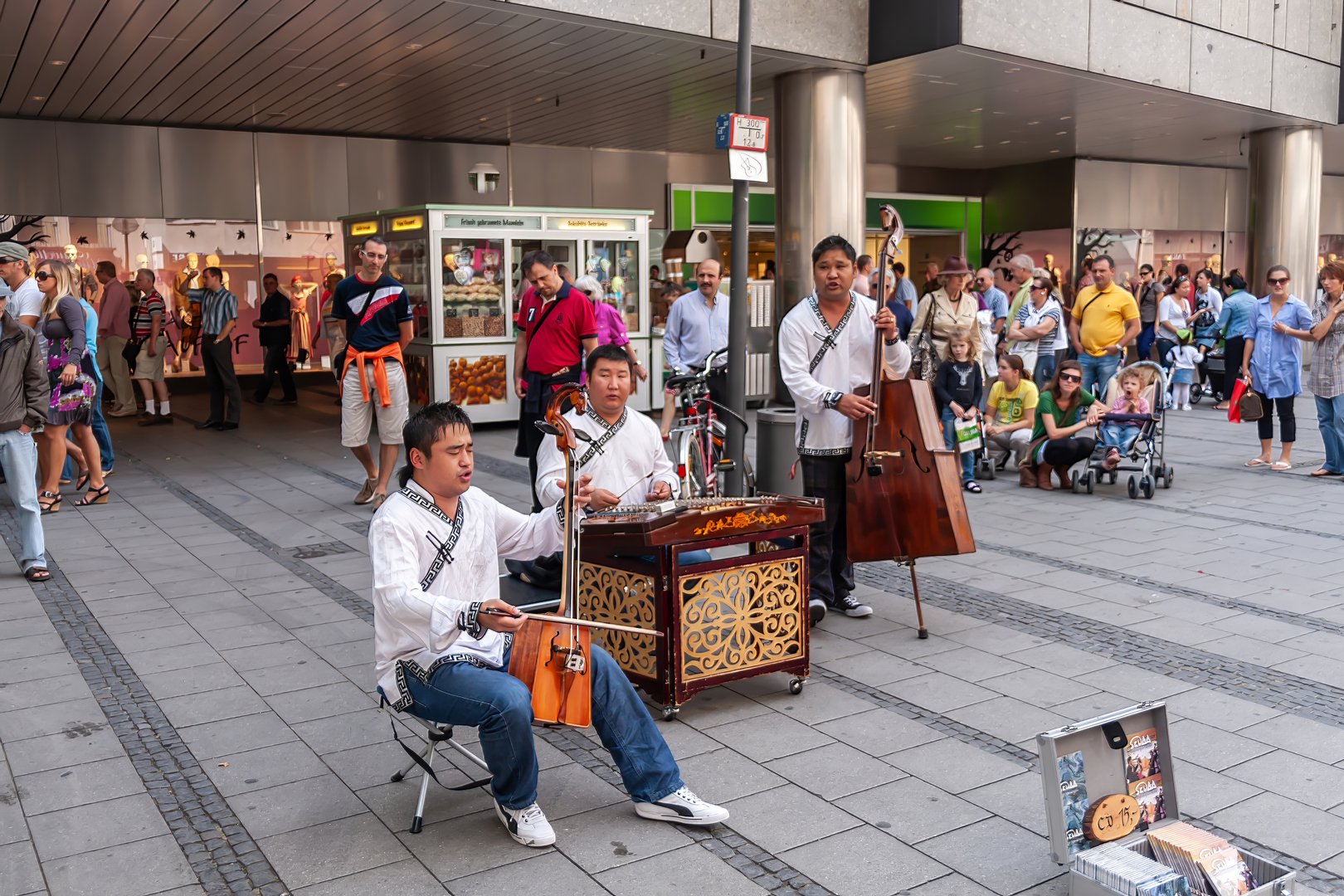 Munich, Germany - August 20, 2010: A group of Mongolian performers dressed in traditional costumes play traditional musical instruments.