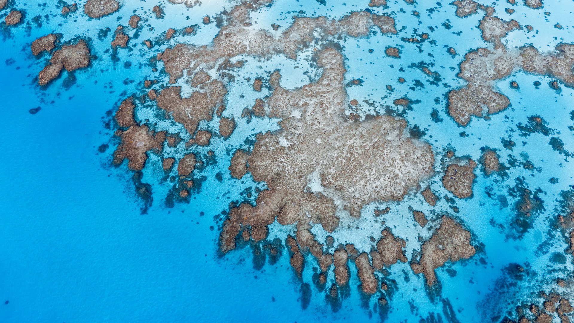 Aerial Views of The Great Barrier Reef ( Lodestone) , during the day and early evening on a glass out day