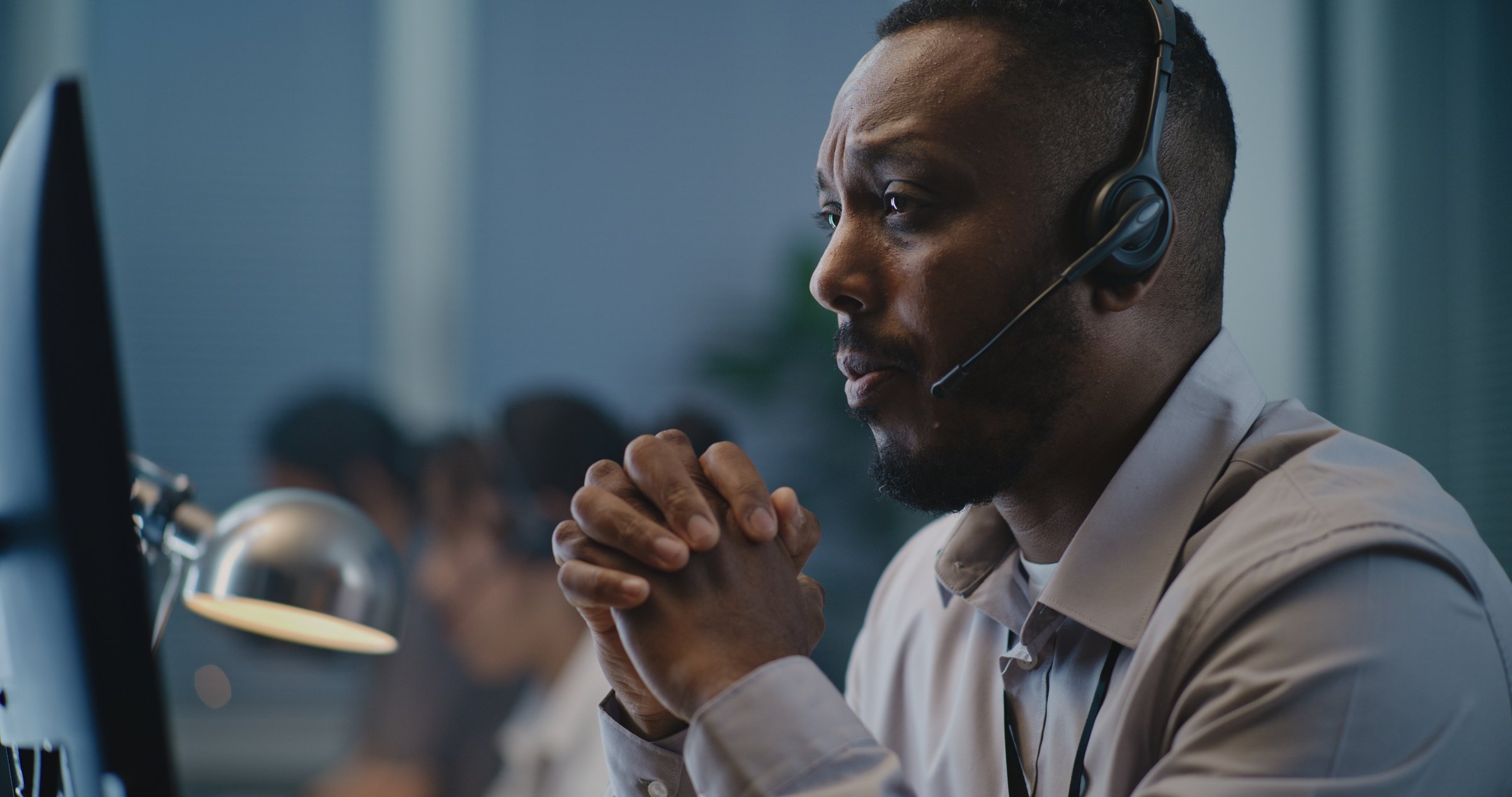 Professional support specialist with headset providing customer assistance