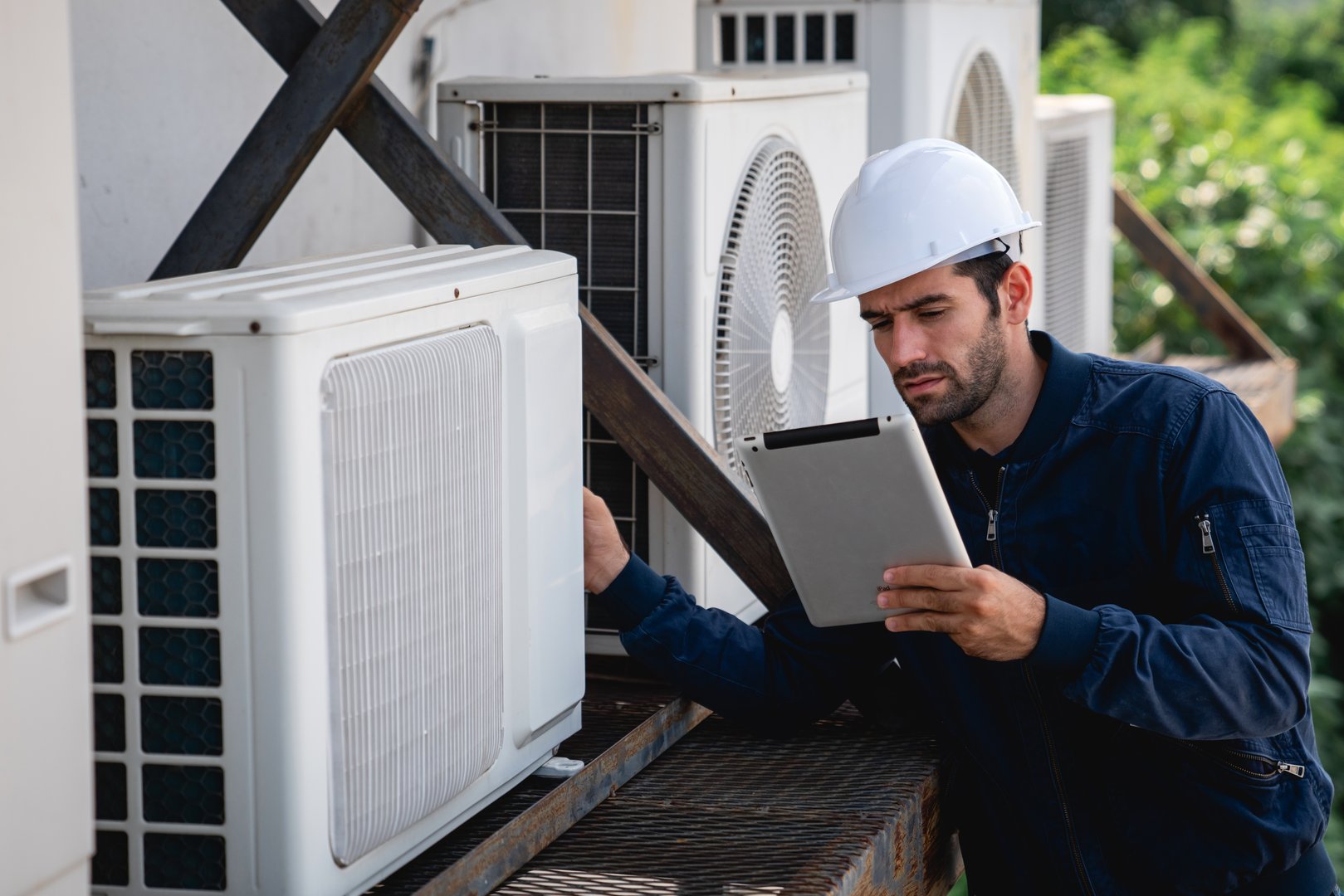 Engineers are inspecting the air conditioning cooling system of a large building or industrial facility.