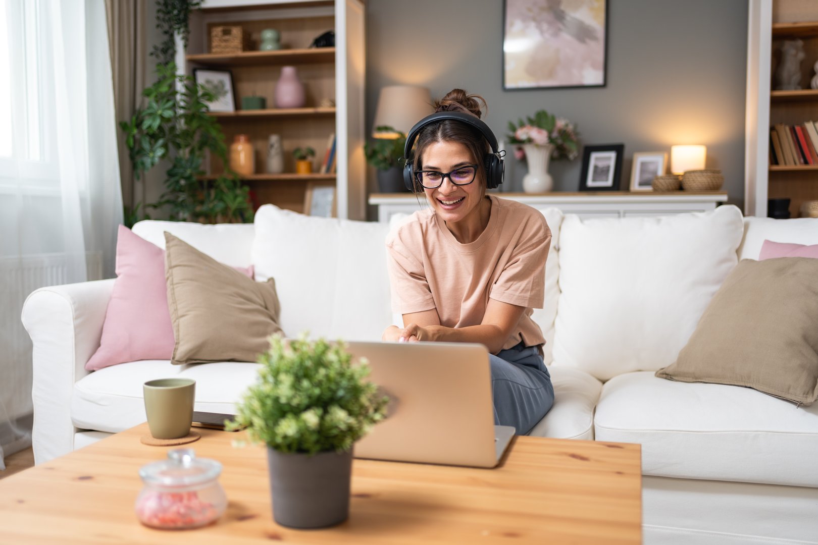 Young woman talking on video call with her psychotherapist doctor after online therapy sessions, happy that she is well and mentally health now after telemedicine conversations.
