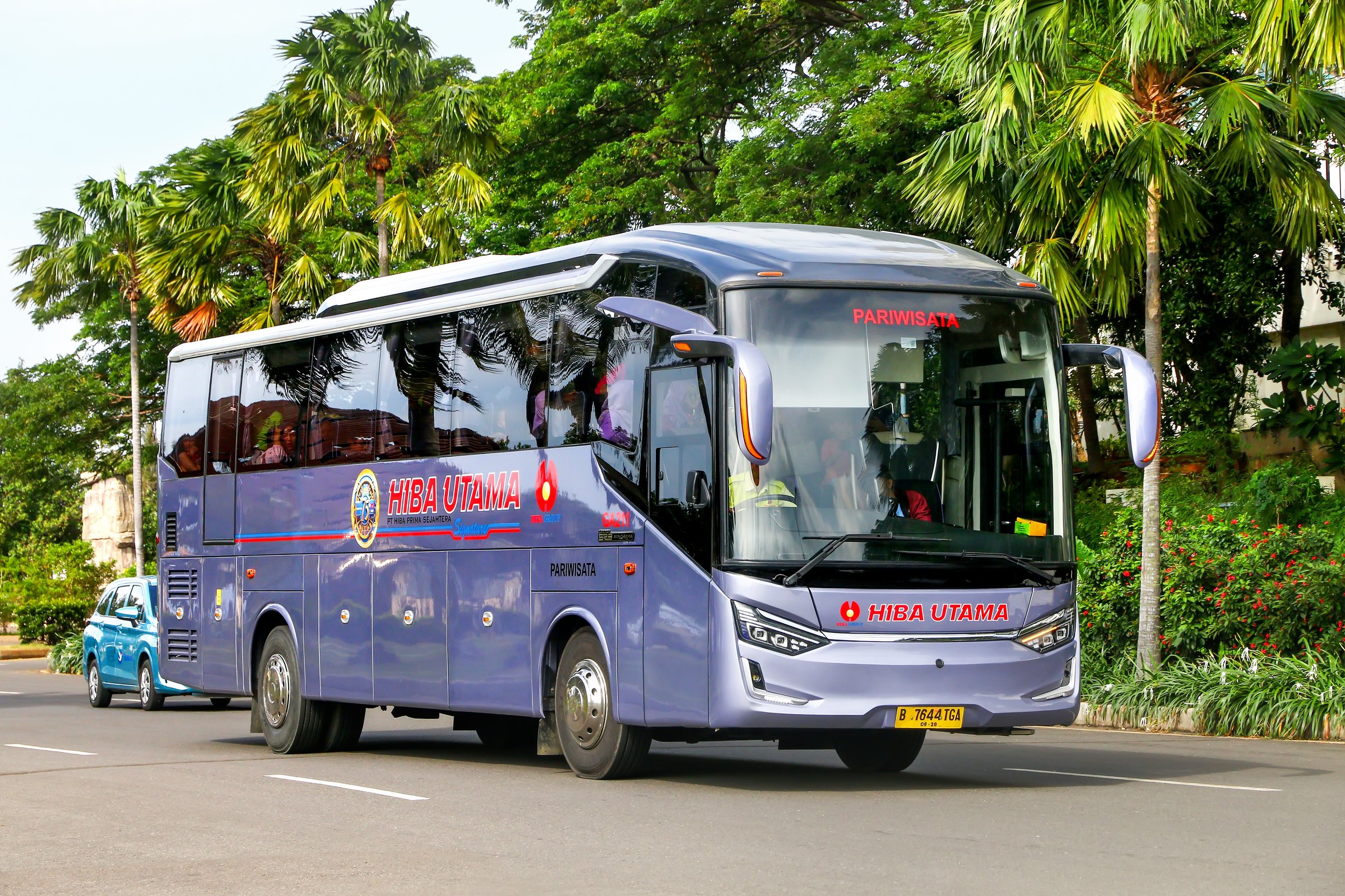 Jakarta, Indonesia - February 19, 2025: Grey touristic coach bus Laksana SR3 Panorama in the city street.