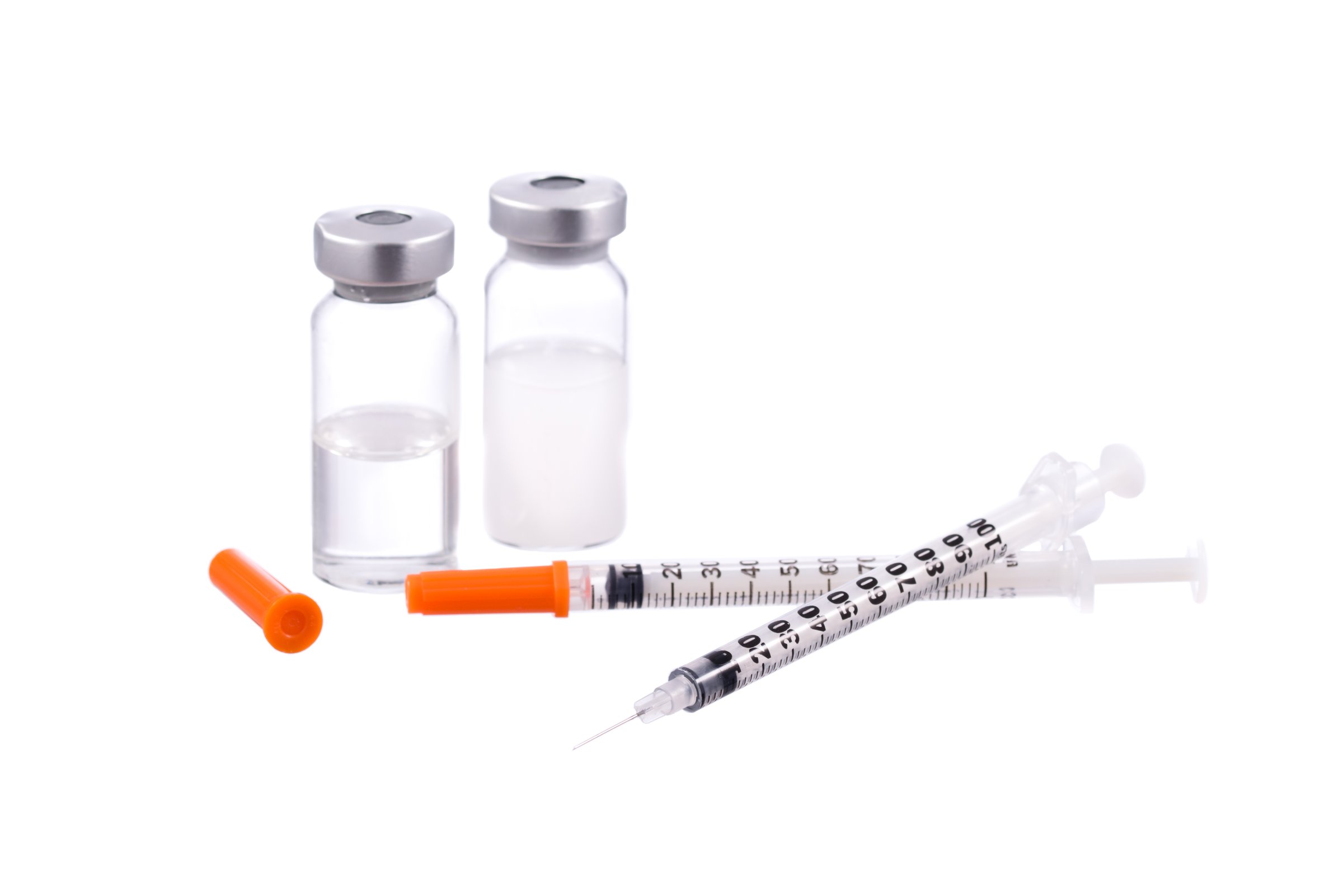 Syringes caps and bottles kits isolated on white background