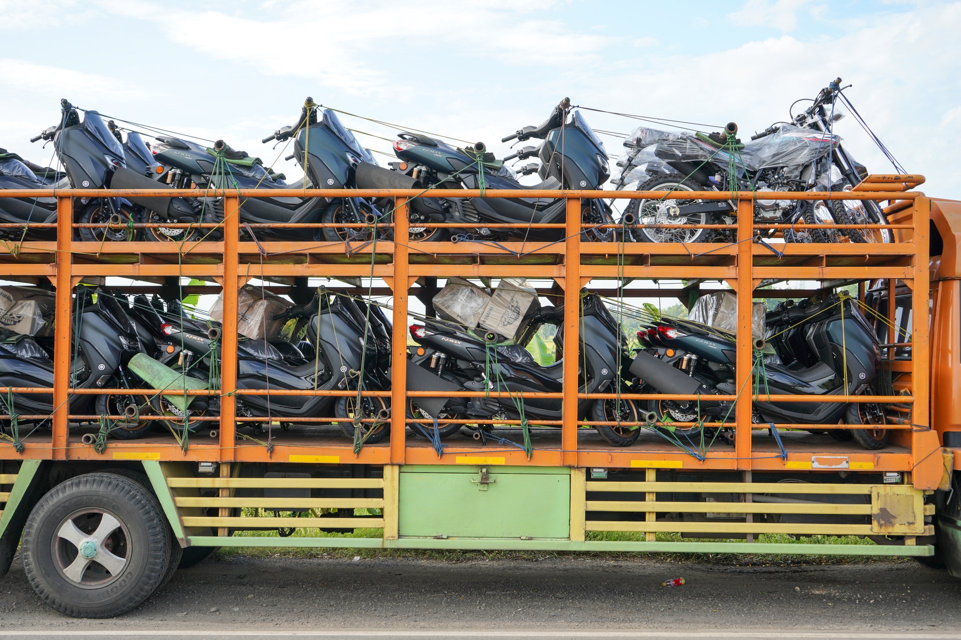 Automatic motorcycle transport truck with several floors that can accommodate large quantities to be sent to the showroom. Pati, Central Java, Indonesia.