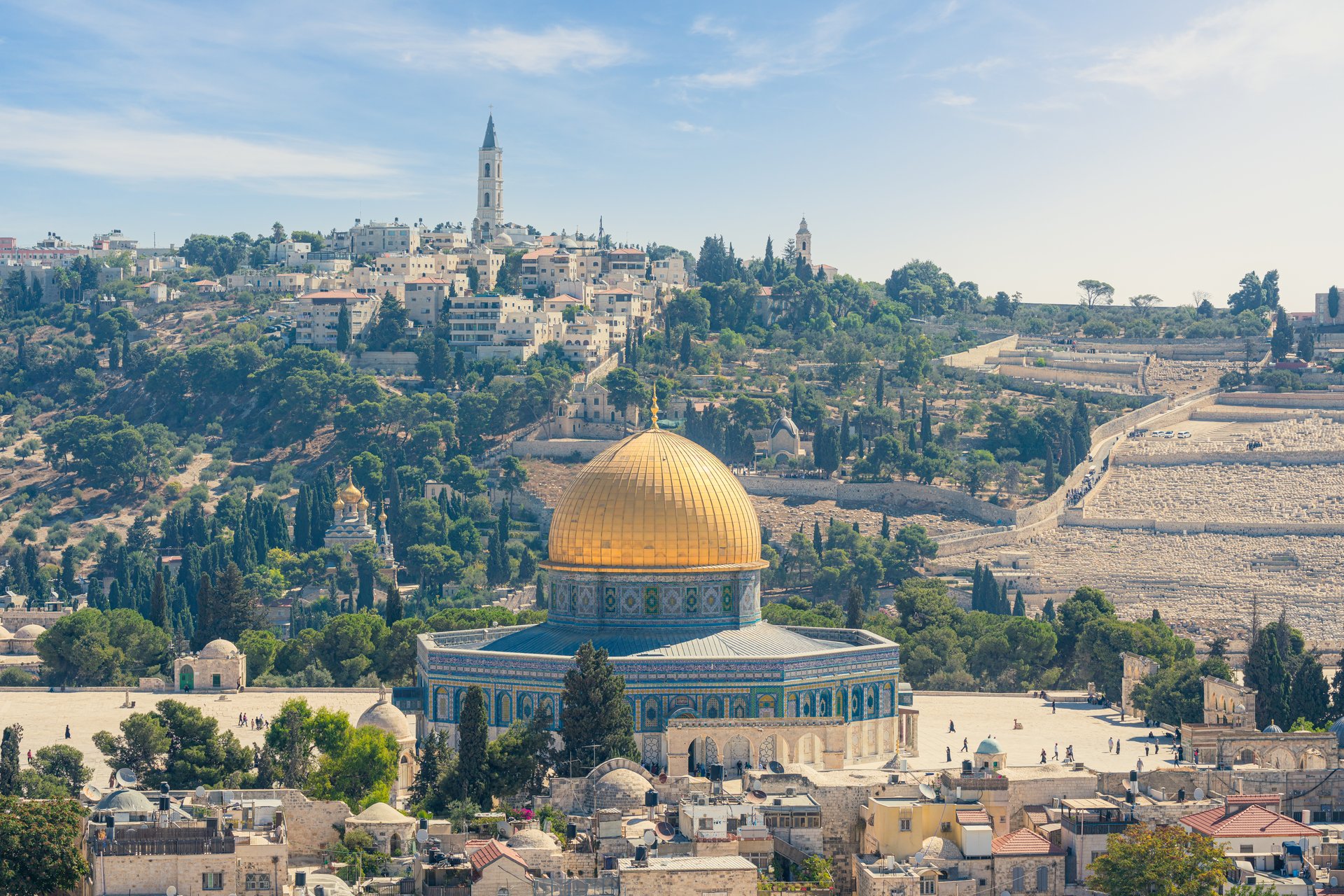 Jerusalem Old City cityscape, the famous Dome of the Rock, a Muslim shrine, shines on top of the Temple Mount also known as Haram al-Sharif. The Mount of Olives is in the background