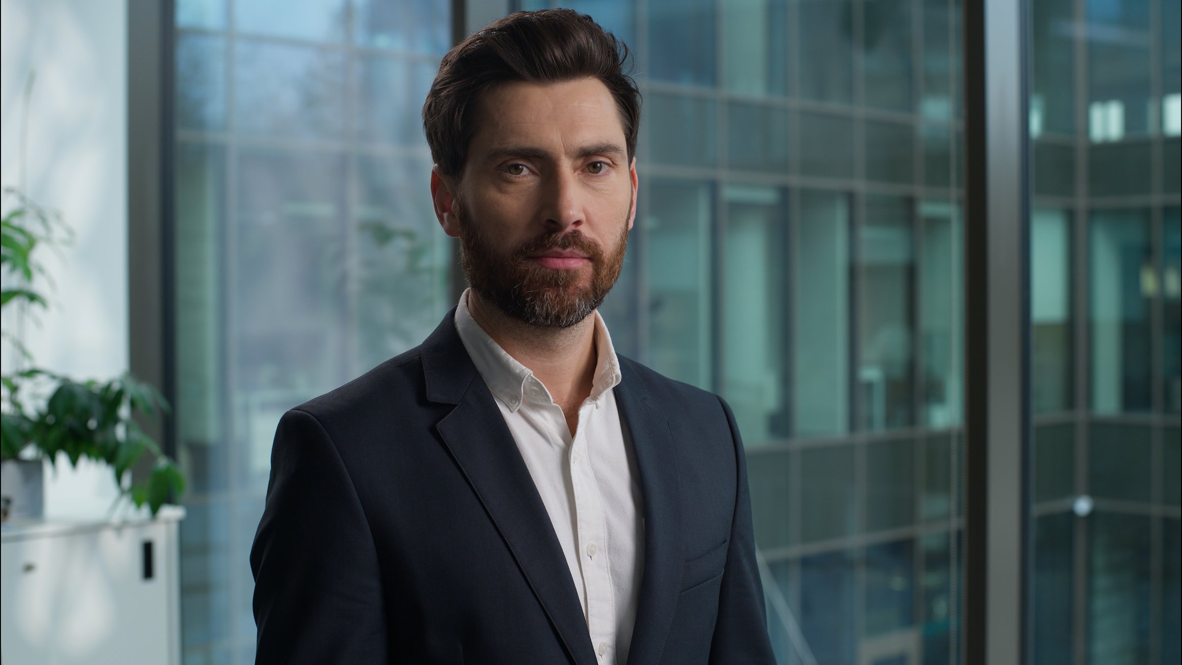 Caucasian man portrait businessman business bearded handsome male turning head looking at camera guy smiling positive leader professional manager employer boss CEO office indoor happy worker executive. High quality 4k footage