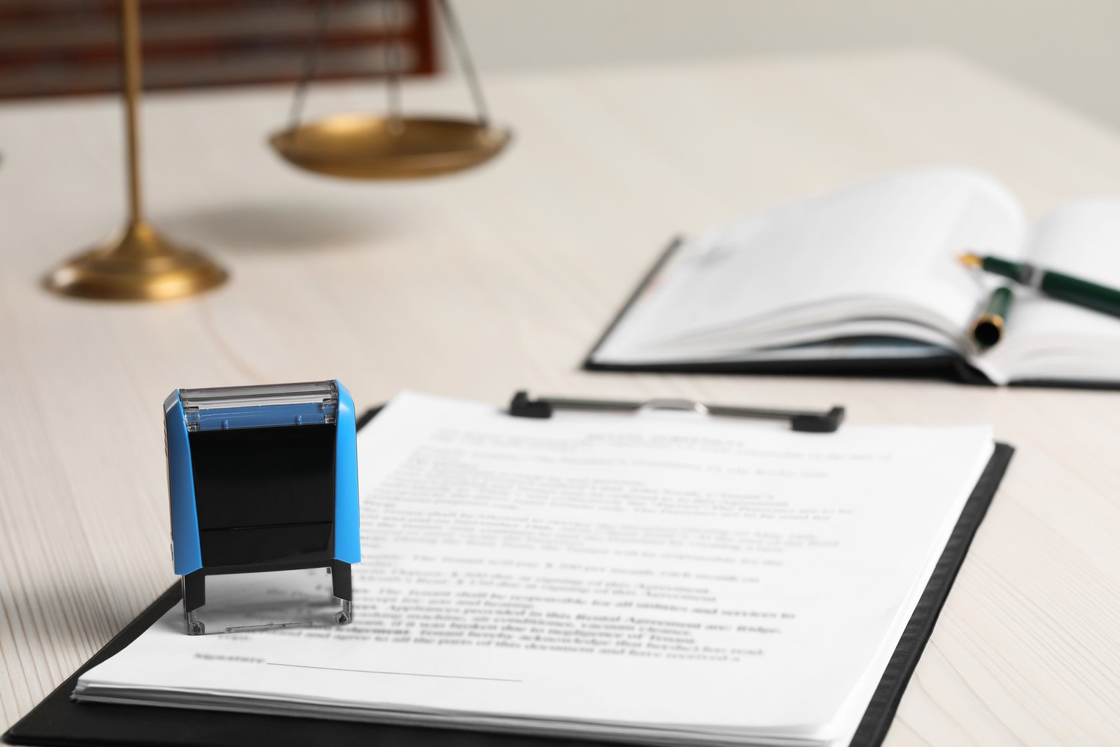 Notary contract documents on wooden table