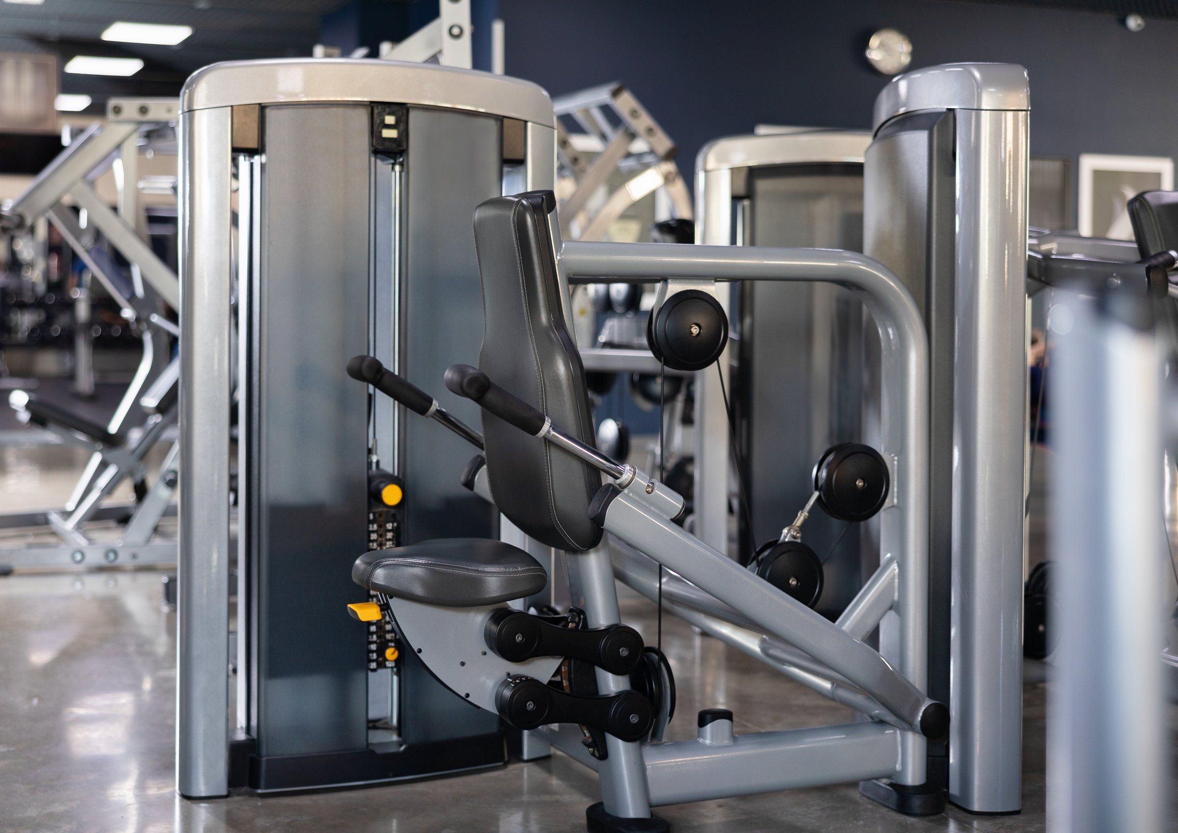 Interior of modern gym centre. TechnoGym simulators