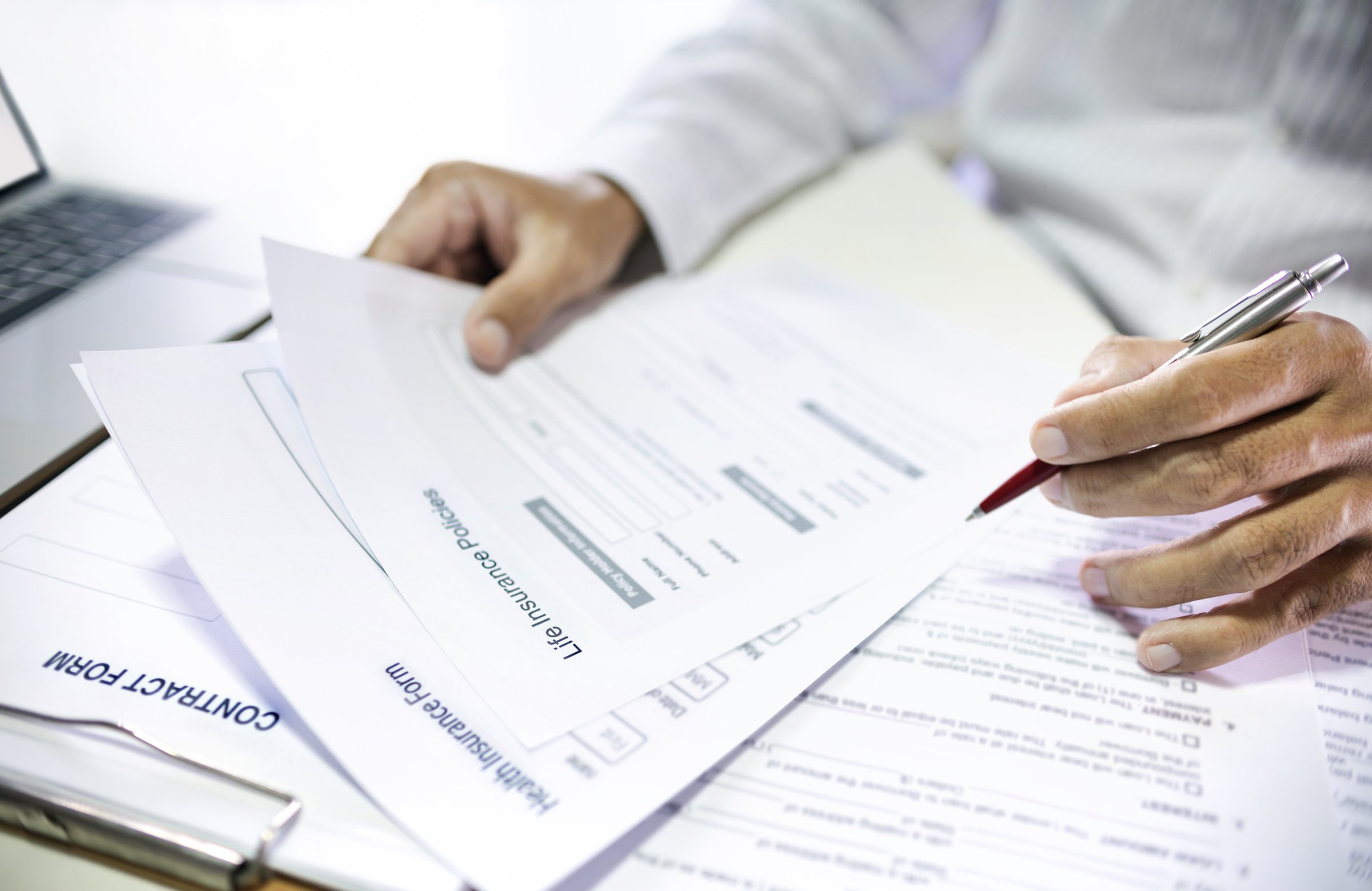 Asian man reading contract making deal with life insurance agent before sign. concept for consultant health insurance, life insurance savings plan, select focus at document