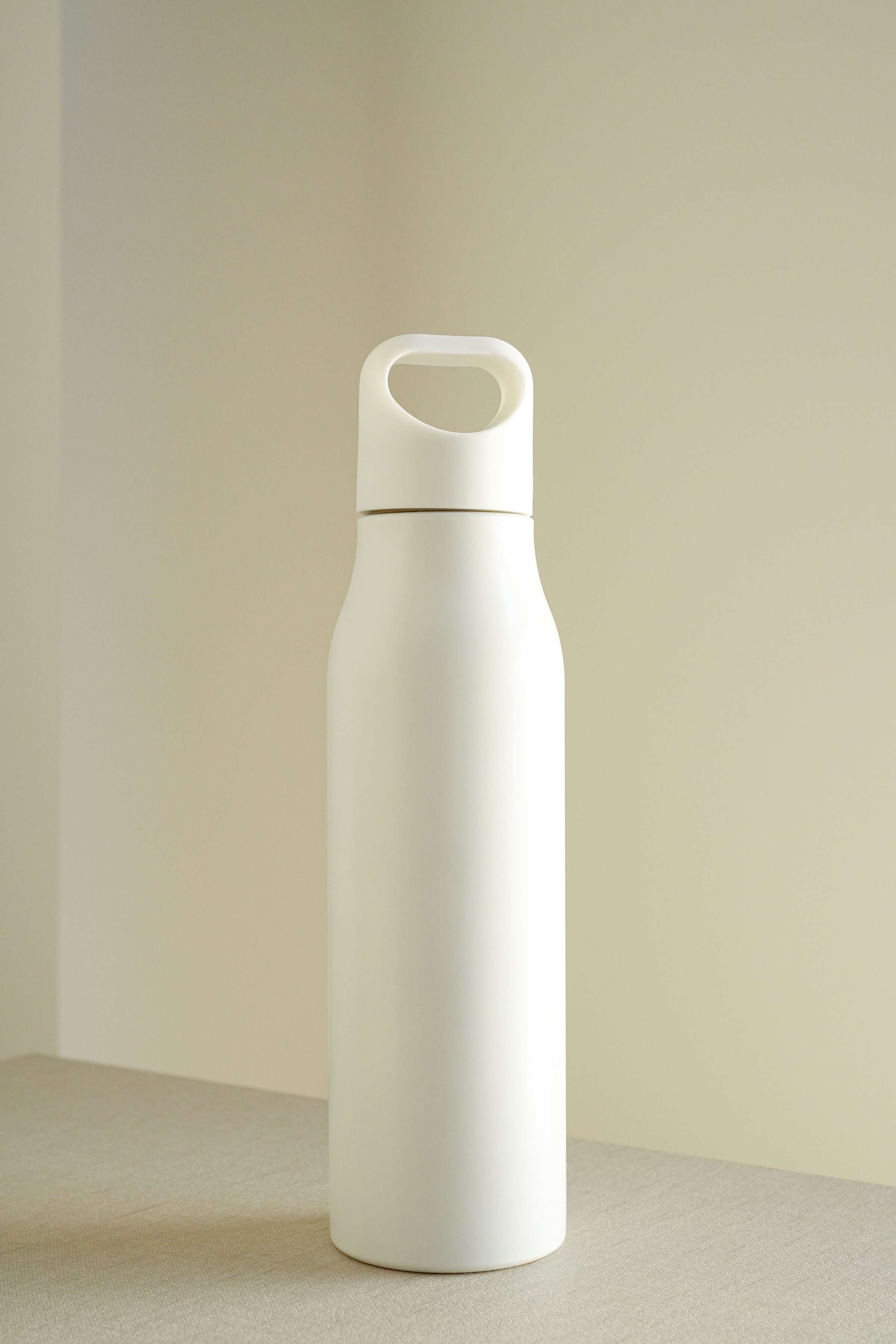 White Stainless Steel Water Bottle with handle on white background , Mockup
