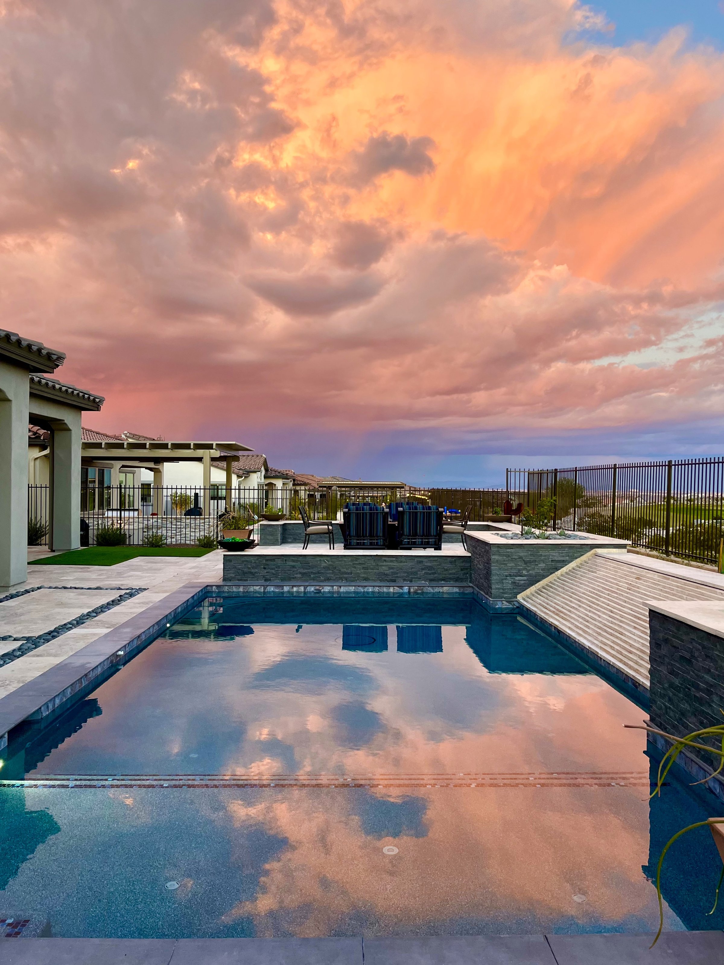 Arizona sunset reflecting over a swimming pool