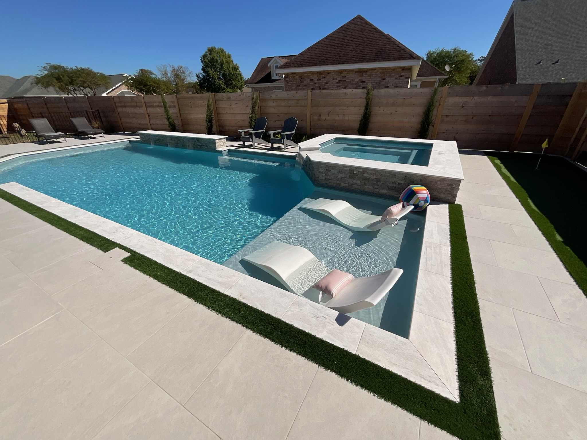 Pool construction South Louisiana - couple enjoying luxury swimming pool