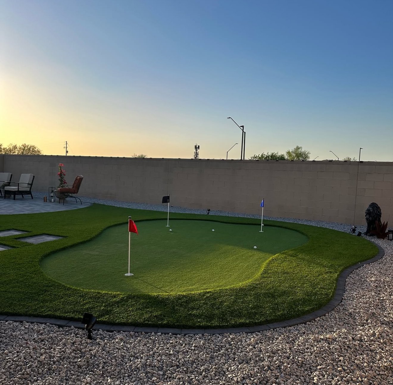 Custom mini golf, artificial turf, pavers, and decorative landscaping rock