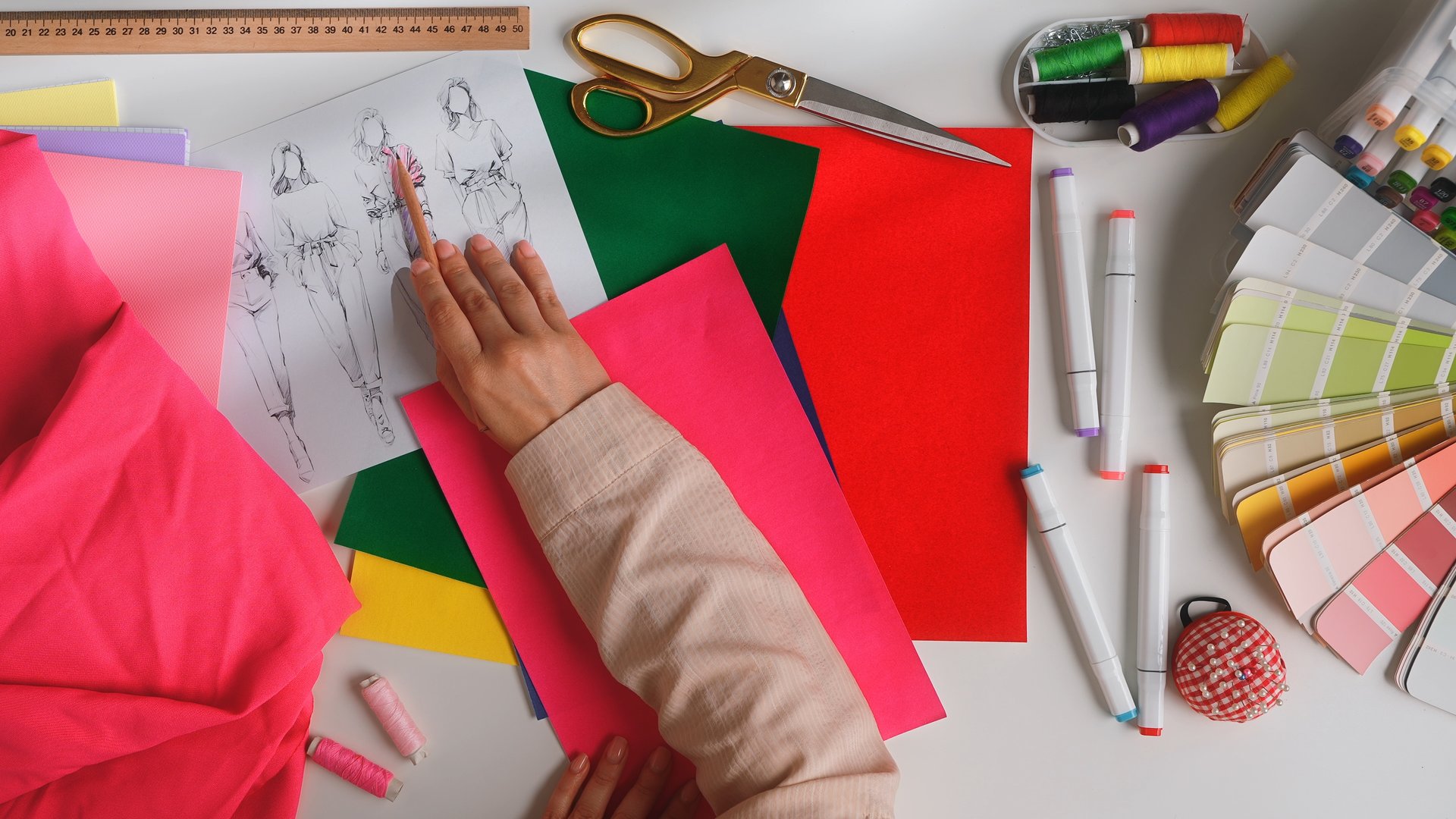 A creative workspace for fashion designers featuring sketches, fabrics, and tools essential for crafting unique styles. Atelier, design and tailoring concept.