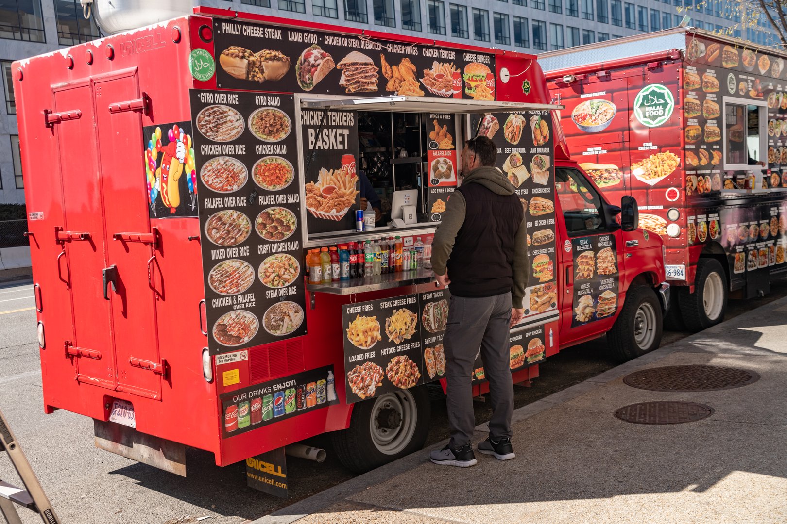 Washington. USA. march 30, 2025 Costumers buy food at a food truck in downtown Washington.