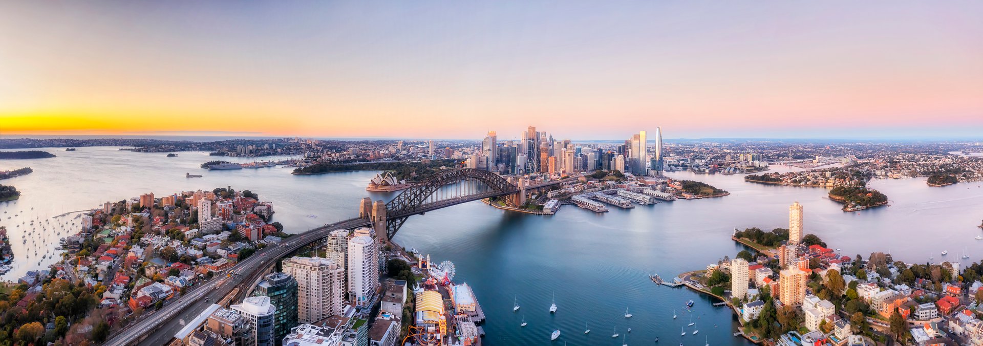 Wide aerial panorama of Sydney harbour around major city architecture landmarks
