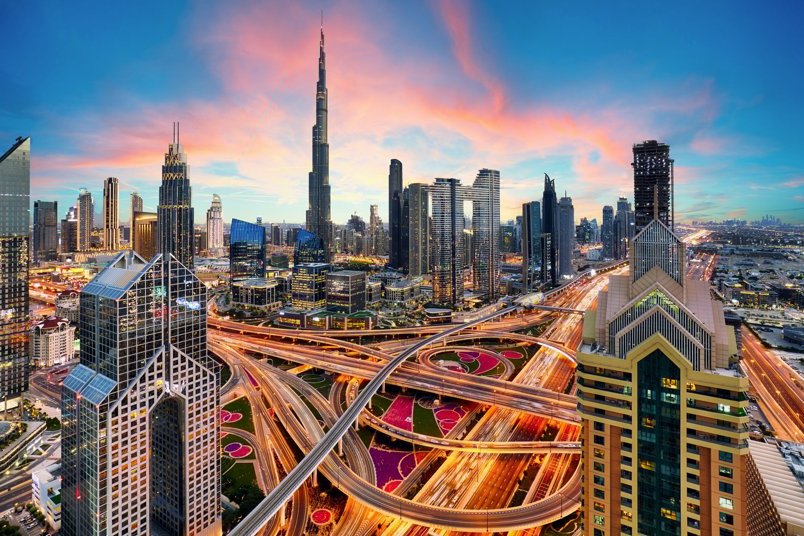 Dubai - city center skyline and bussy evening after sunset at night, United Arab Emirates