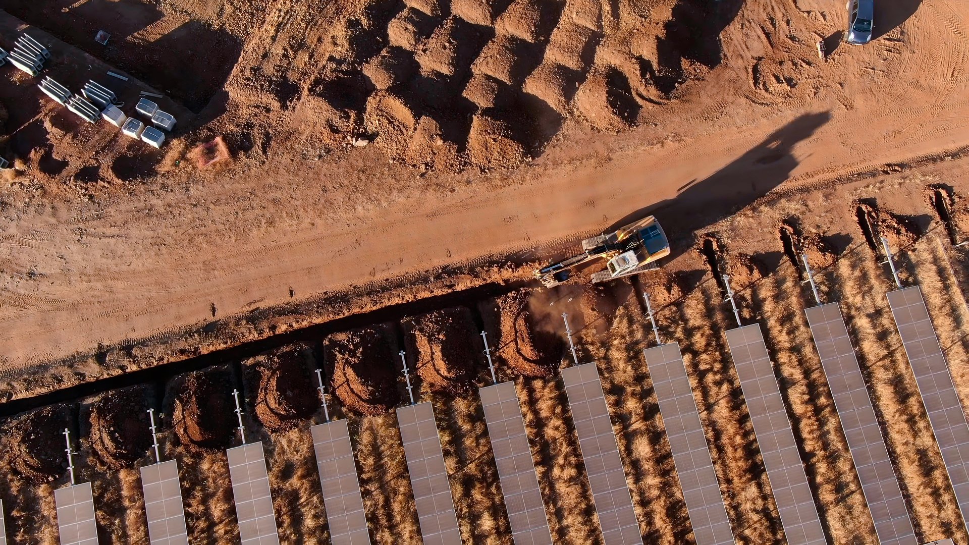 Trench excavation process for the installation of solar panel banks with machinery