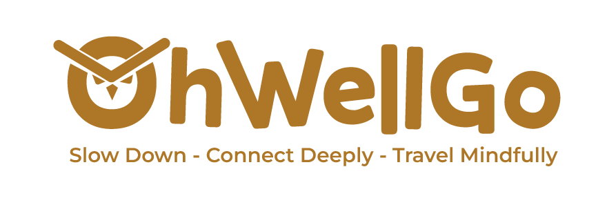 Logo for Oh Well Go with a slogan Slow Down - Connect Deeply - Travel Mindfully and an abstract clock design.