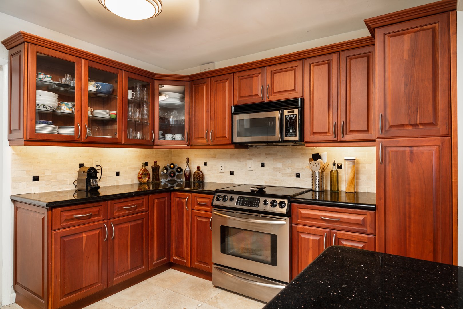 Traditional kitchen with wood cabinets and granite countertops