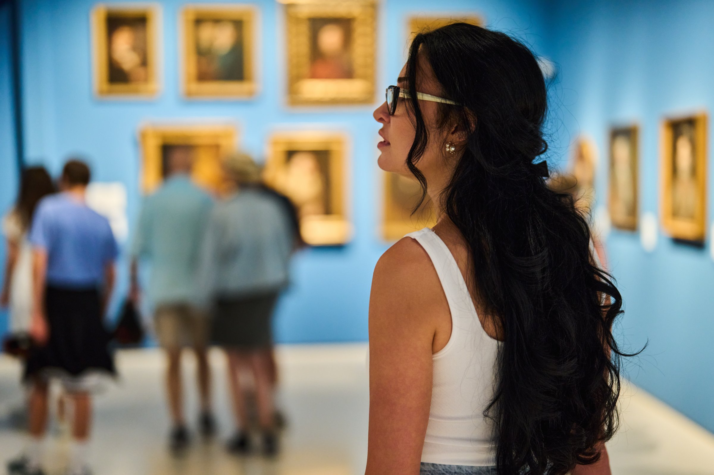 women in the museum looks at art exhibitions gallery