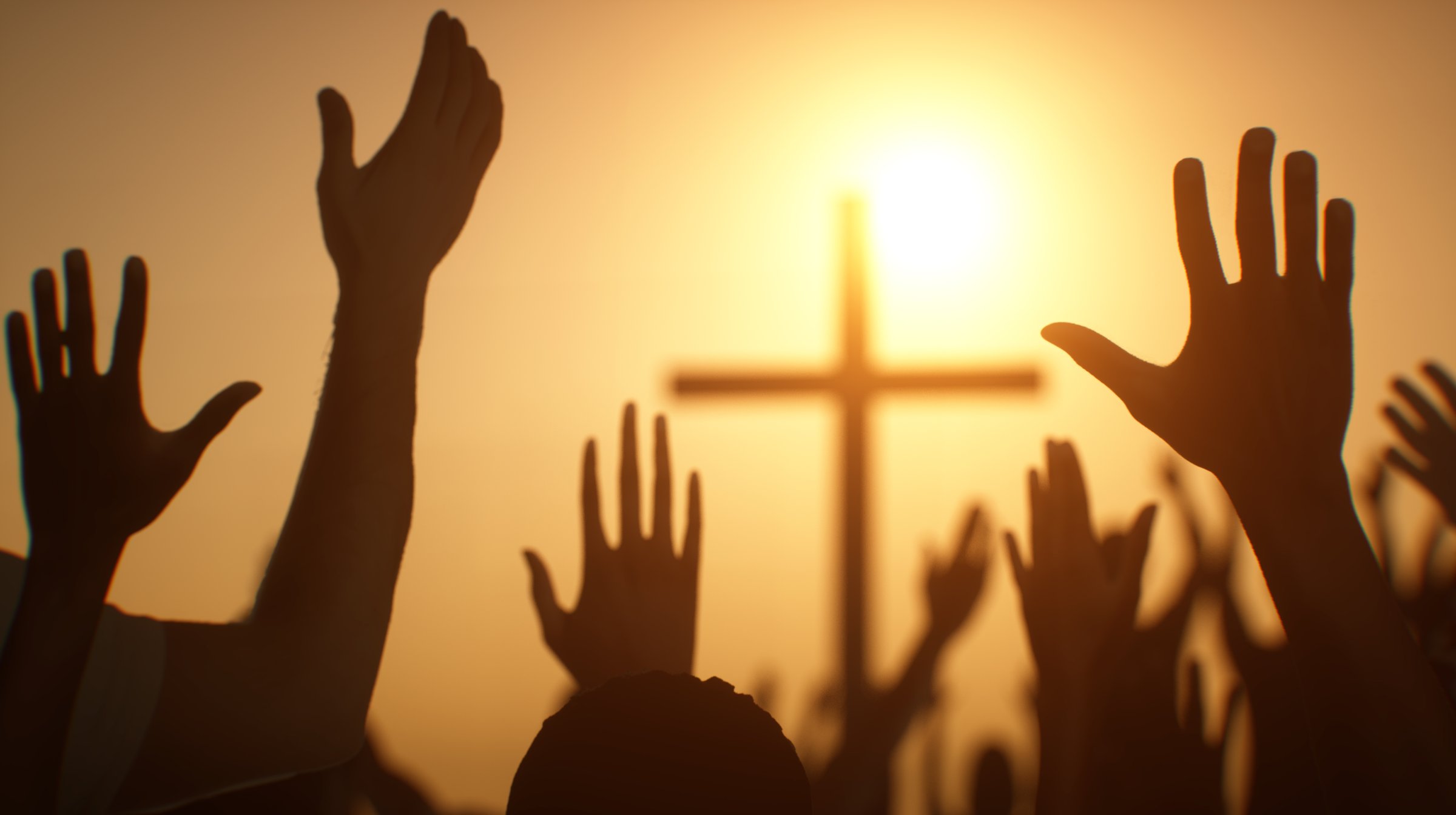 the silhouette of a Christian cross with the  worship praying people hands render 3d