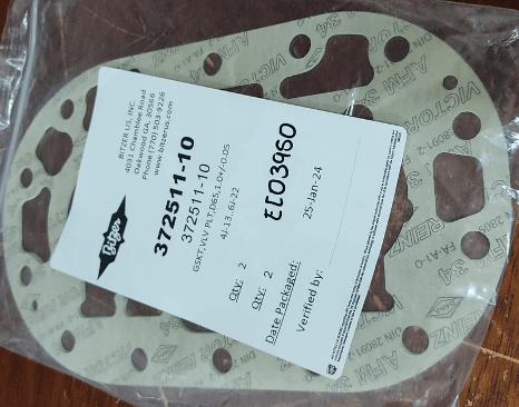 Gasket set labeled with part number 372511-10 in plastic packaging on a wood surface.